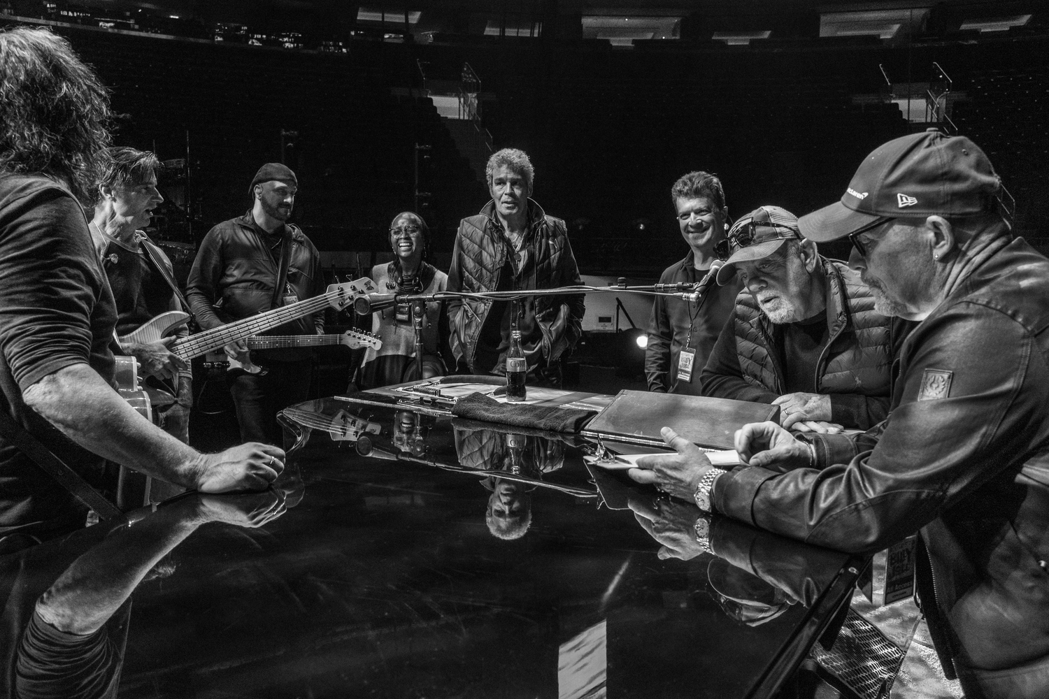 Billy Joel and his band with Steve Cohen gathered around the piano at Madison Square Garden. MYRNA SUAREZ