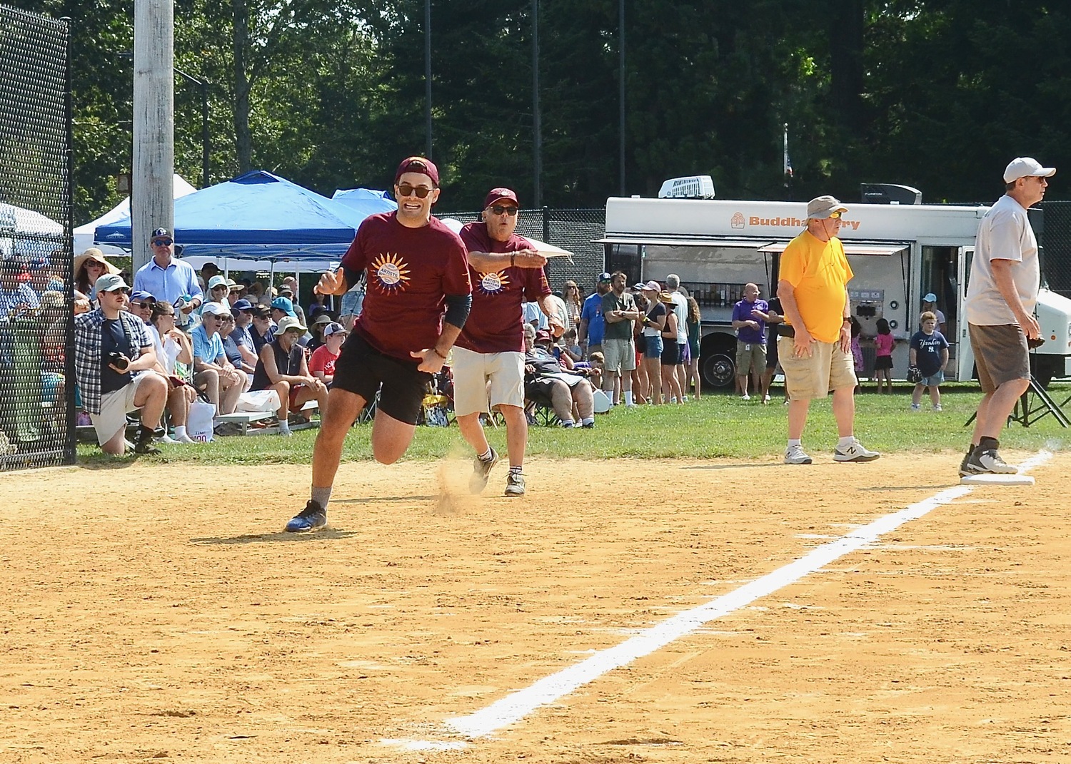 A Writer rounds third base and heads home.  KYRIL BROMLEY