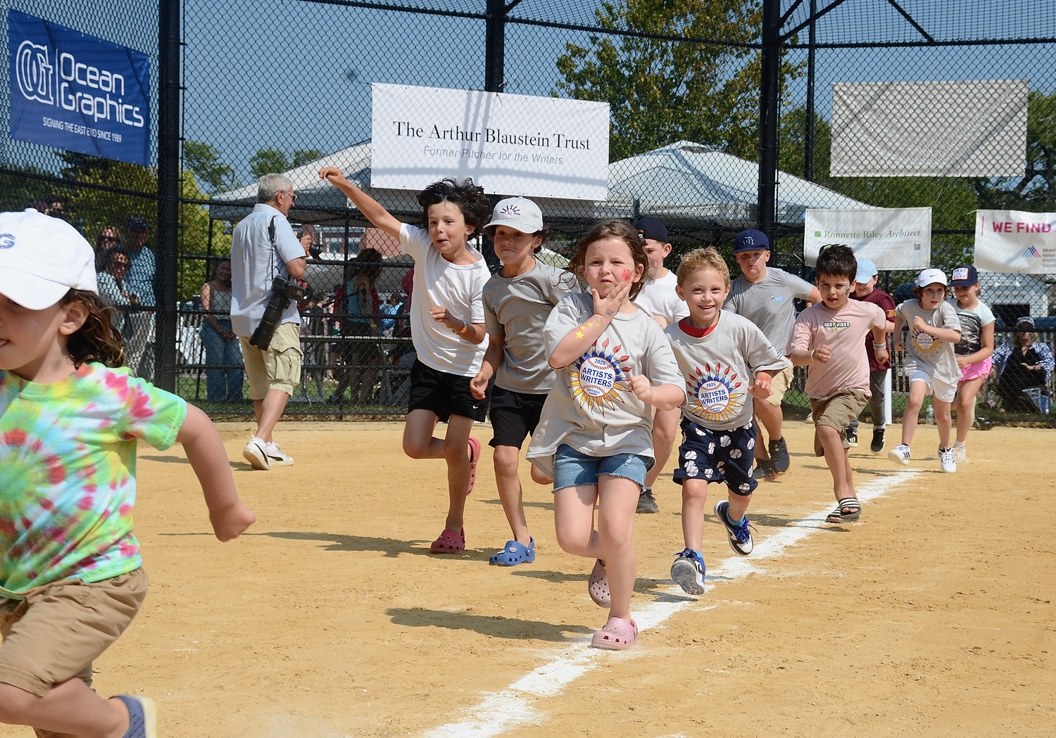 The kids round the bases.  KYRIL BROMLEY