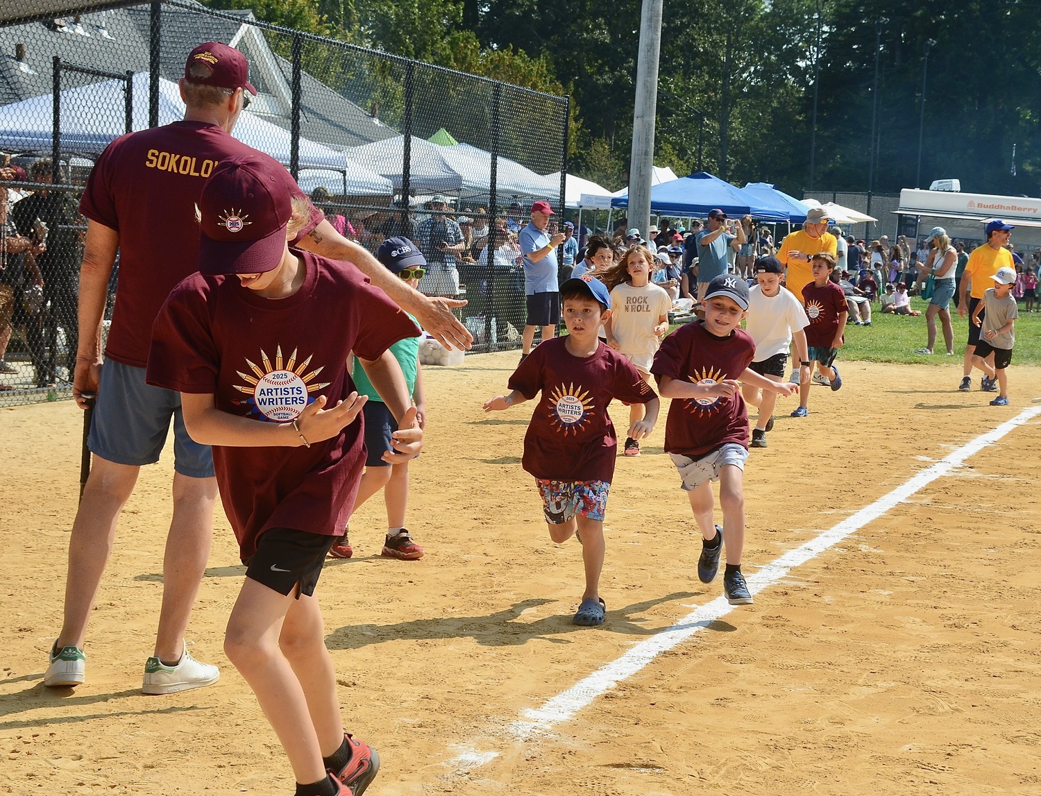 The kids run around the bases.  KYRIL BROMLEY