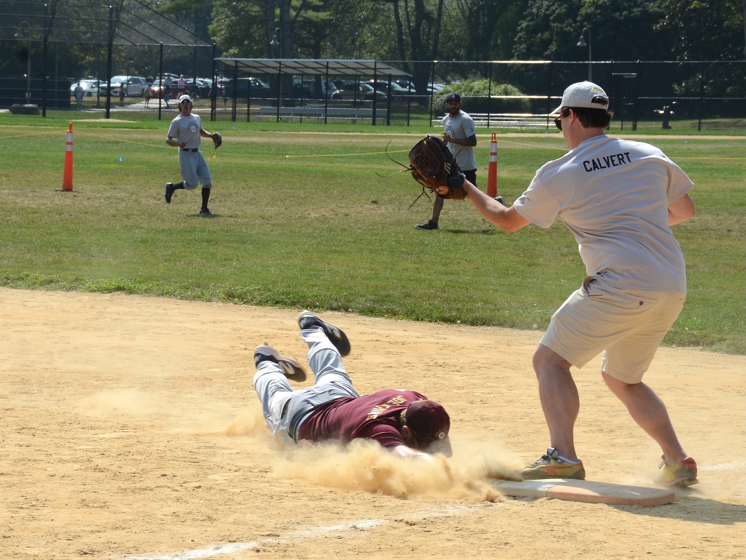 A Writers dives headfirst back to first base.  KYRIL BROMLEY
