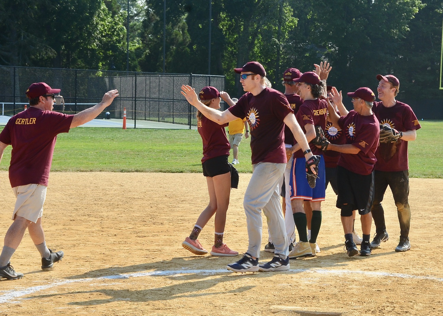 The Writers congratulate themselves on their 9-6 victory on Saturday afternoon.  KYRIL BROMLEY