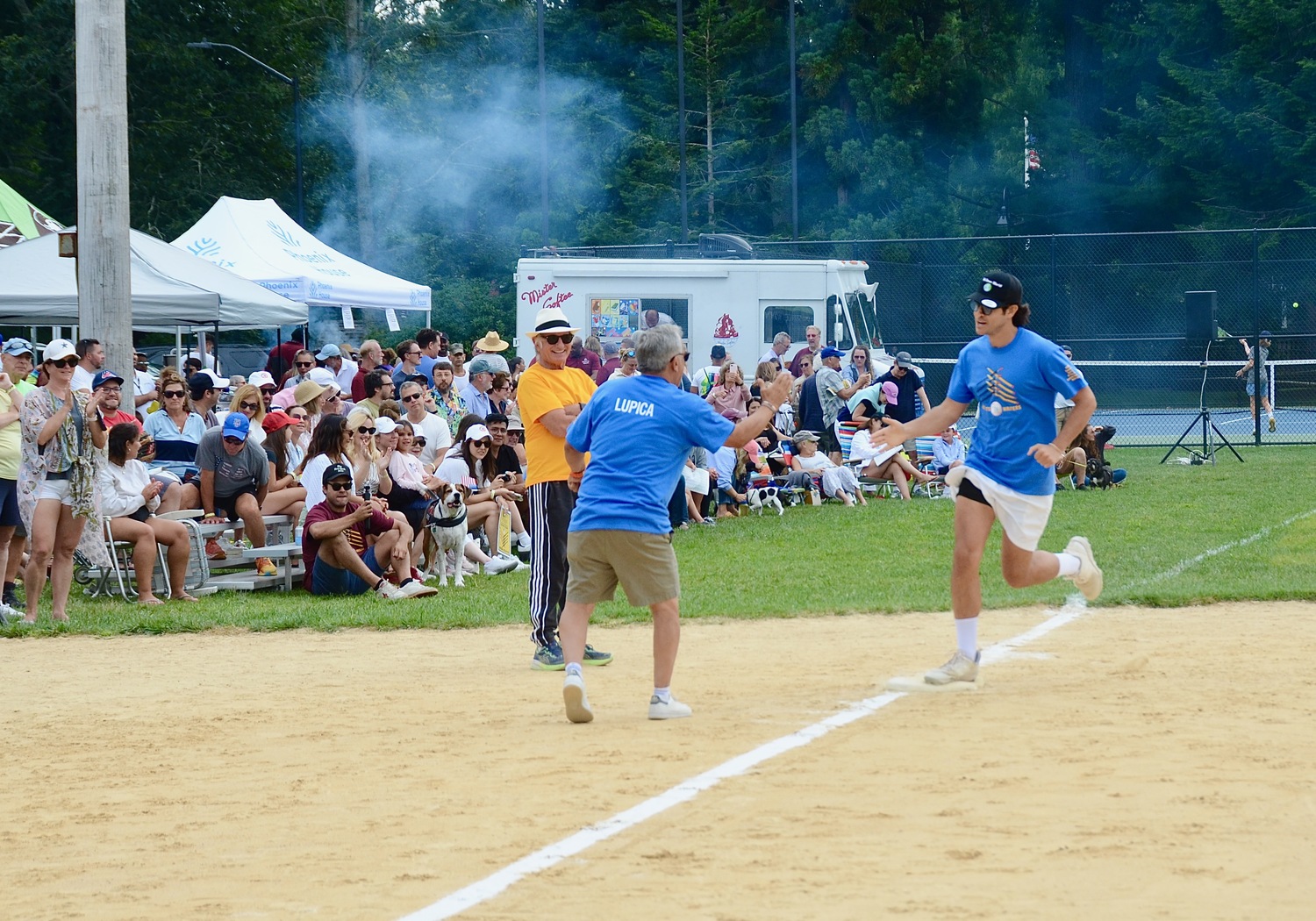 A Writer rounds the bases after a home run, getting cheered on by MIke Lupica.  FILE PHOTO