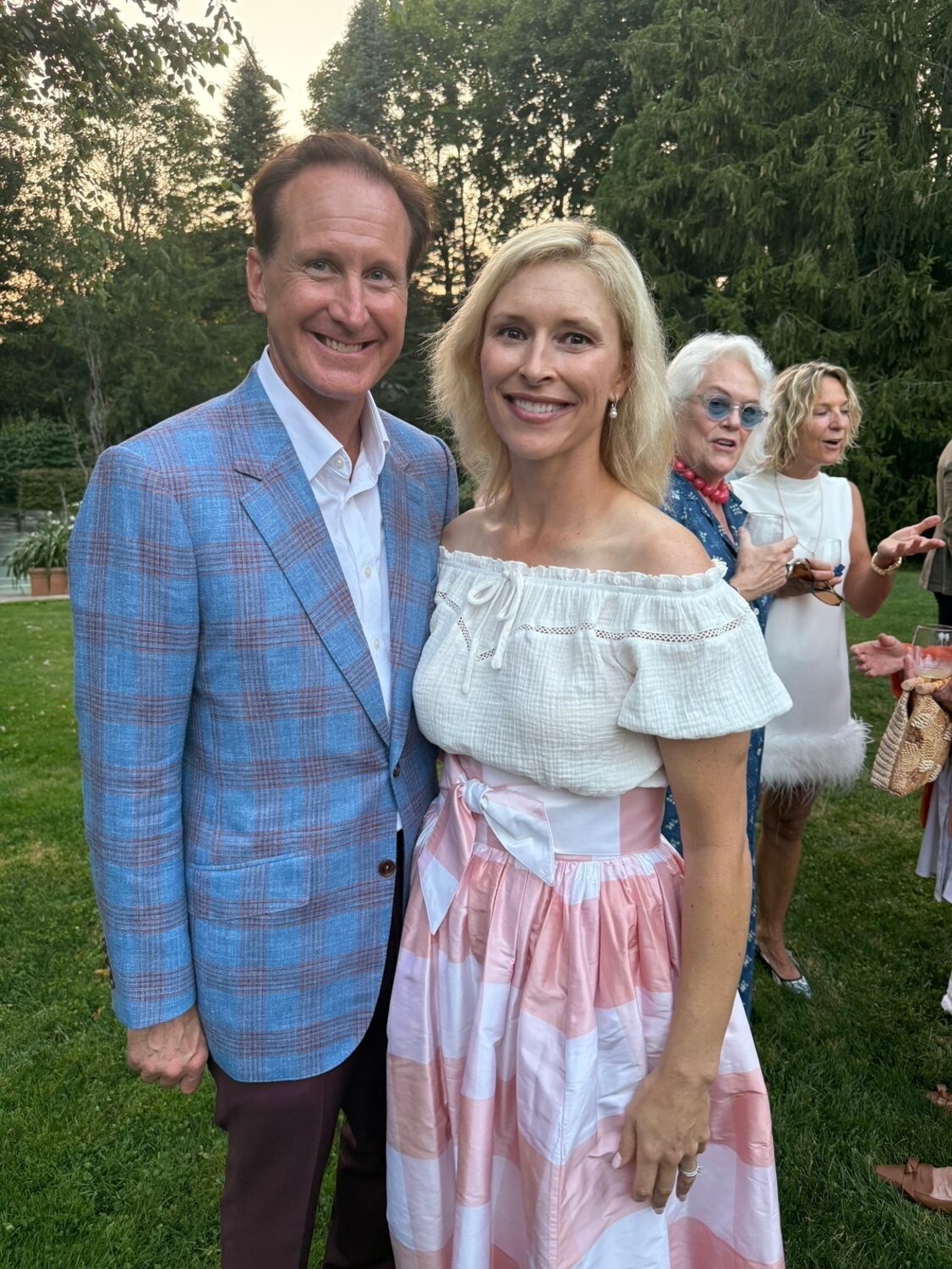 As part of their barely more than 24 hour swing through the Hamptons, Kentucky Governor Andy Beshear and wife Britainy were feted at a cocktail party in the garden of Rob Coburn and Averitt Buttry’s Hill Street home along with co-hosts Lizzz Kritzer, Danielle Lise Desrochers, Steven Stolman and Rich Wilkie. From left, Southampton Village Mayor Bill Manger and Britainy Beshear.  COURTESY STEVEN STOLMAN