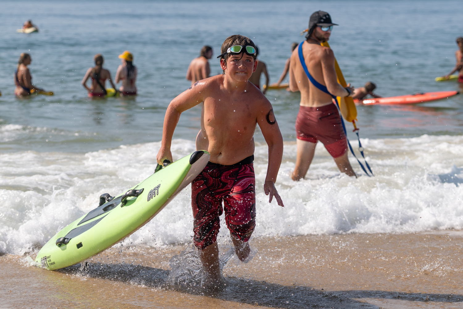 A junior lifeguard competing in the rescue board relay.  RON ESPOSITO