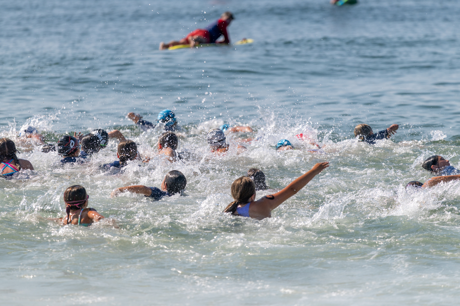 Junior lifeguards head out into the water at Atlantic Avenue Beach in Amagansett.  RON ESPOSITO