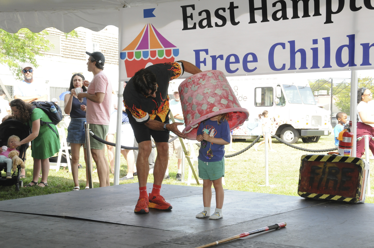 The East Hampton Library hosted its annual Children's Fair on Sunday in Herrick Park with a variety of fun for everyone, including inflatable rides, games, food, performers, crafts, author signings and more.   RICHARD LEWIN