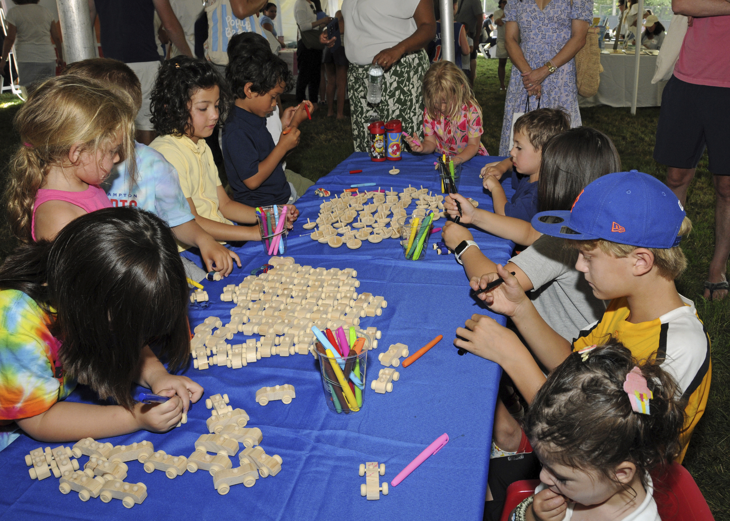 The East Hampton Library hosted its annual Children's Fair on Sunday in Herrick Park with a variety of fun for everyone, including inflatable rides, games, food, performers, crafts, author signings and more.   RICHARD LEWIN