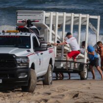 East Hampton Town lifeguards remove the stand from Indian Wells Beach on Tuesday afternoon, in preparation for large swells from Hurricane Erin on Wednesday. Most beaches will be closed to swimming on Wednesday and Thursday as the surf is anticipated to create dangerous rip currents. DOUG KUNTZ