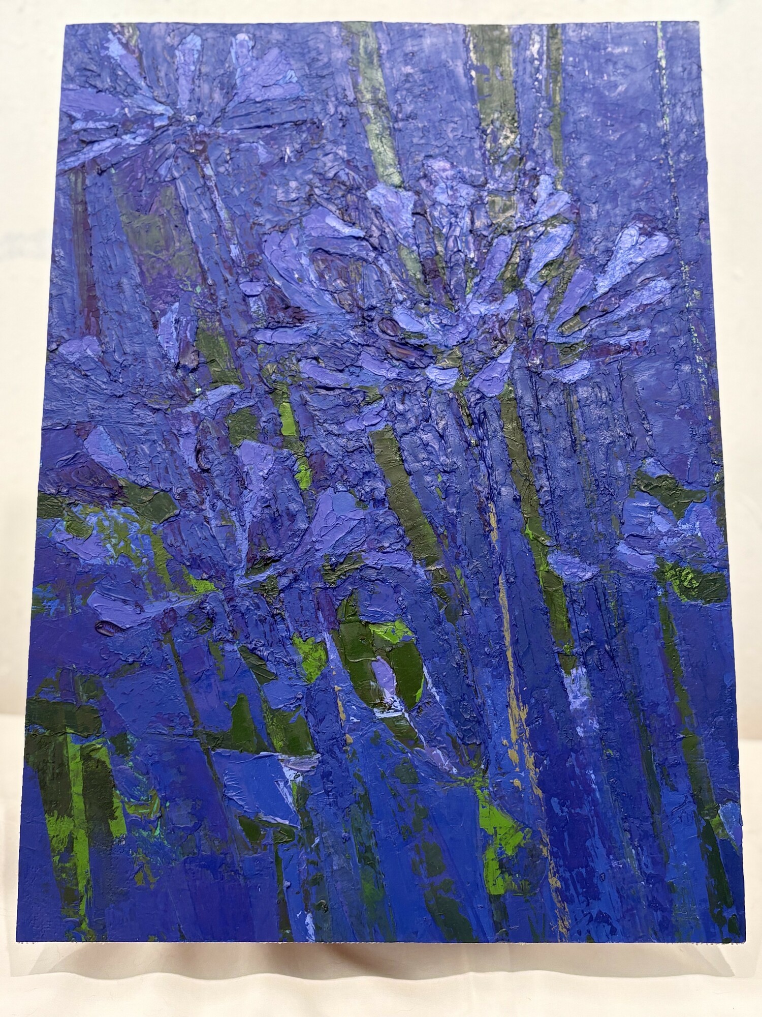 Eric Dever's canvas painting which is attached to the box using a Velcro trip so buyers can hang it wherever they choose.