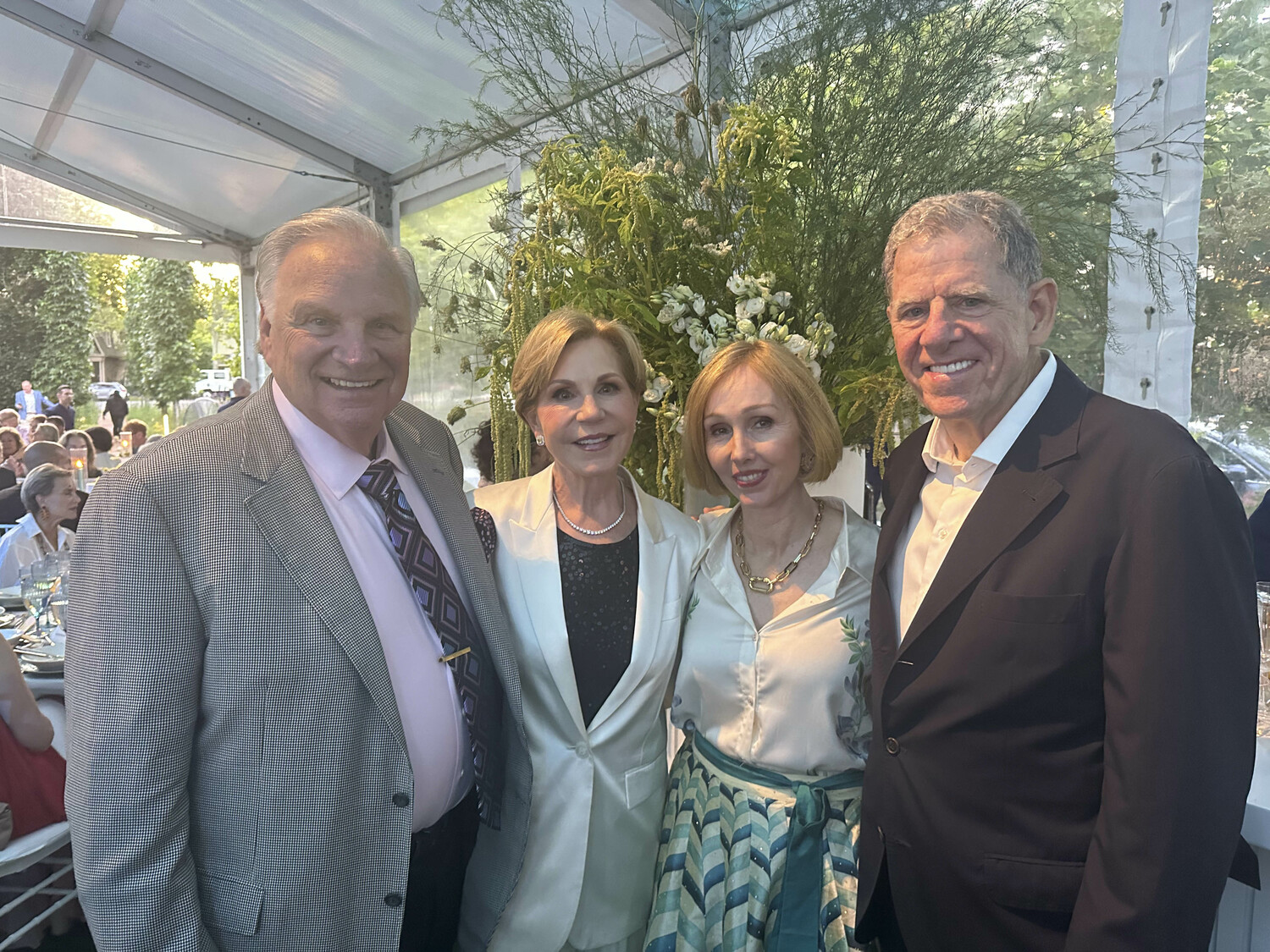 Howie and Louise Phanstiel, Andrea Grover and Marty Cohen at the Guild Hall Summer Party.  GREGORY D'ELIA