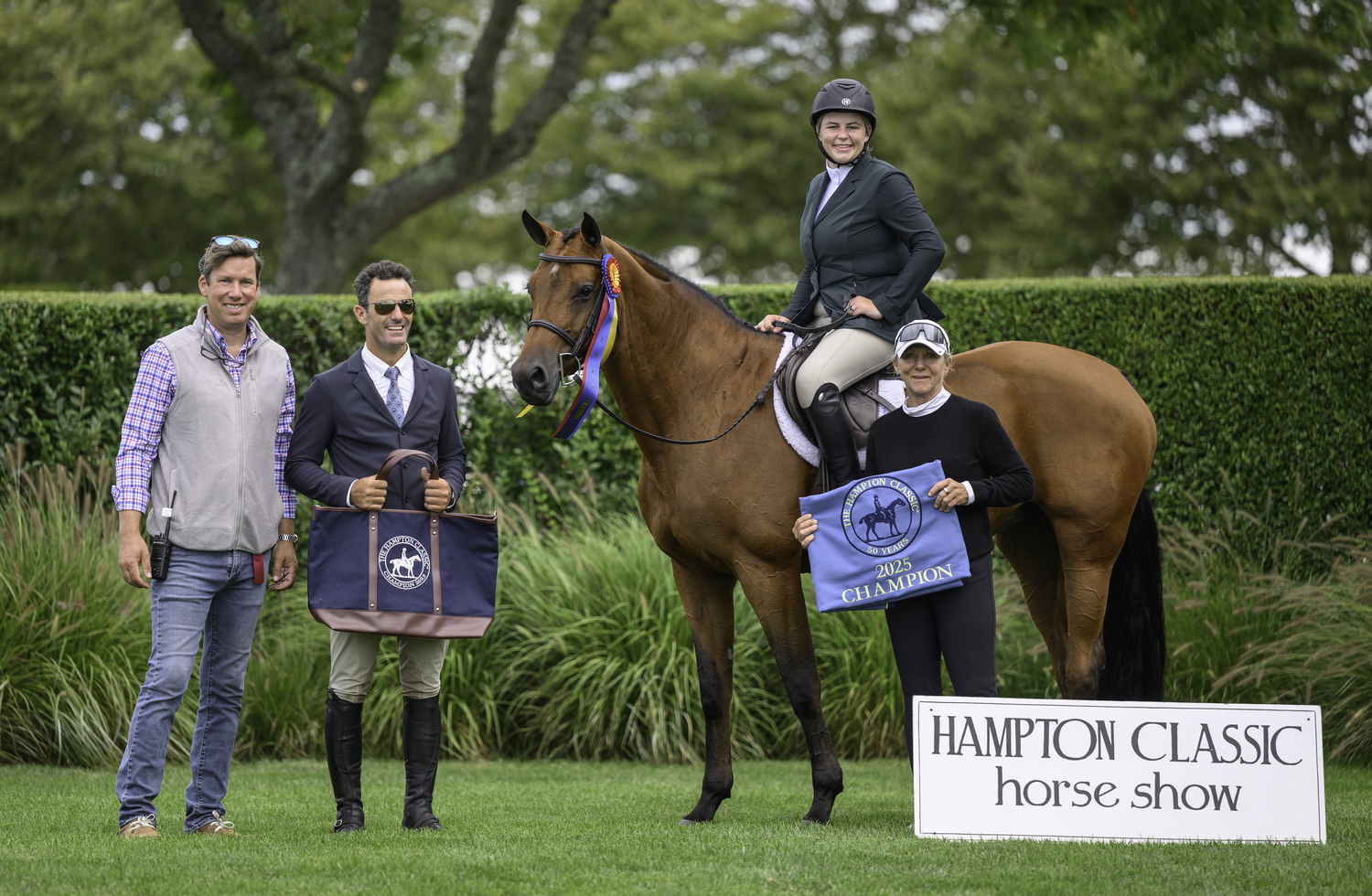 Local Junior Hunter grand champ Samantha Teller on Edgewood's Wonder with Heidi Eearle Santos LaMarca and Isiah Robinson.  MARIANNE BARNETT