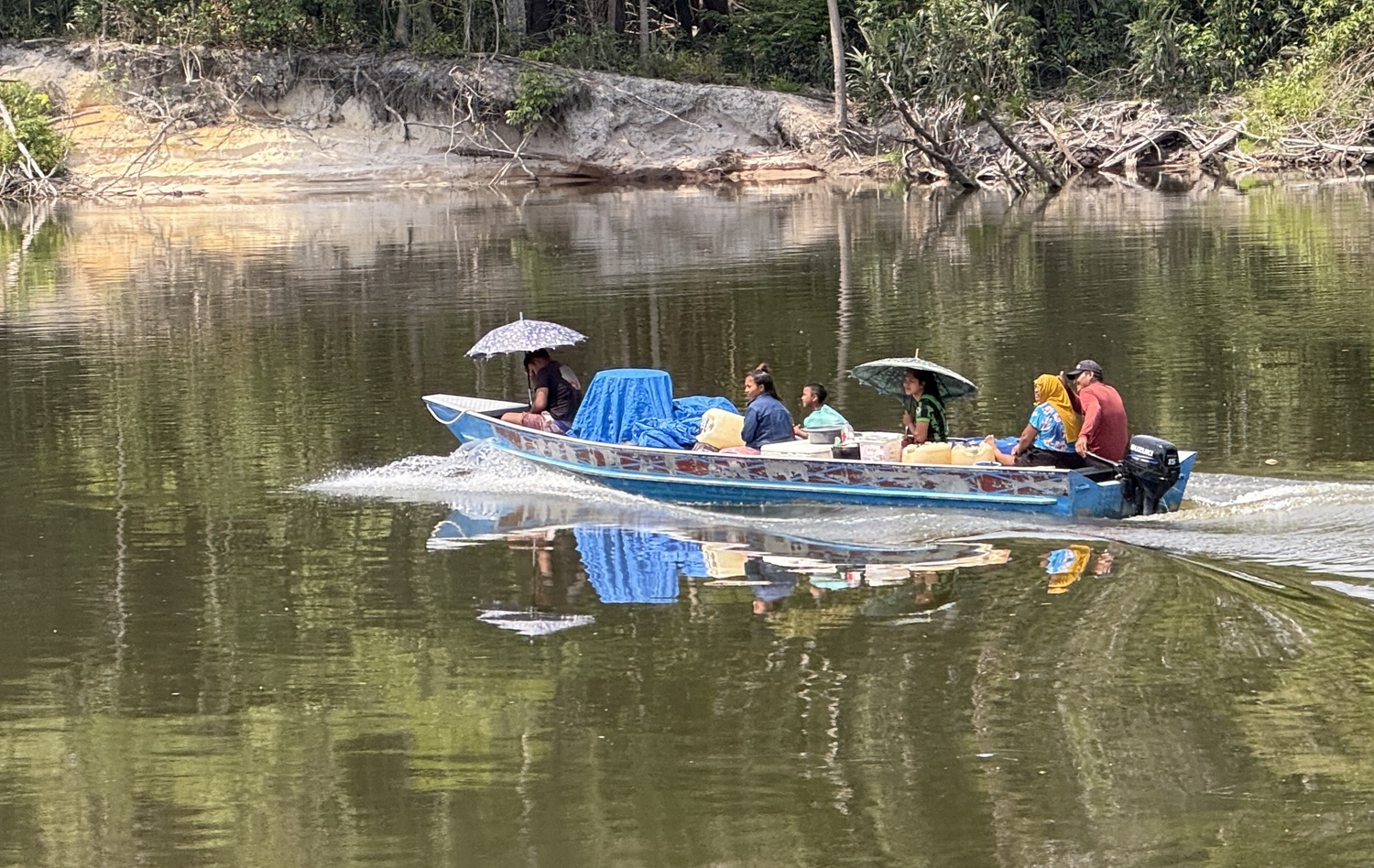 A local family riding along the Amazon.