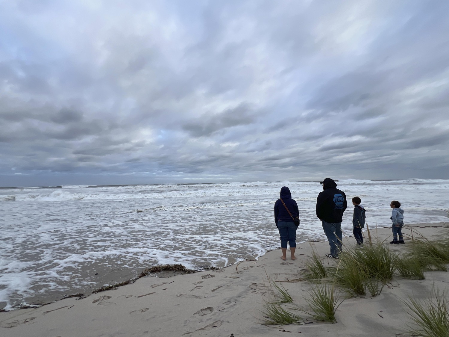 Spectators flocked to Ponquogue Beach in Hampton Bays on August 21 to watch the tide come in as the remnants of Hurricane Erin come through.  DANA SHAW