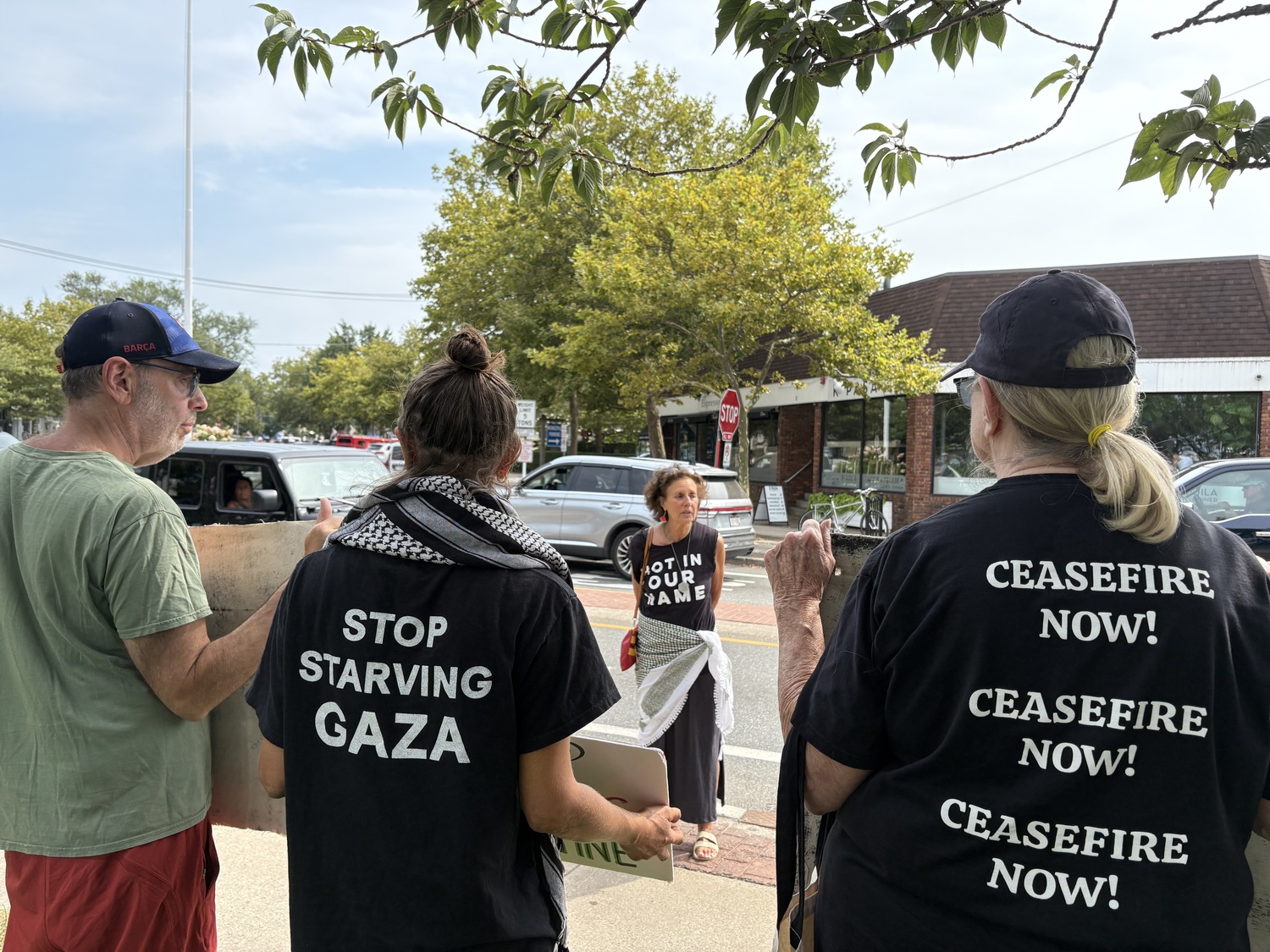 Kathy Engel, one of the founders of East End for Peace and Justice, speaks during the vigil. CAILIN RILEY PHOTOS