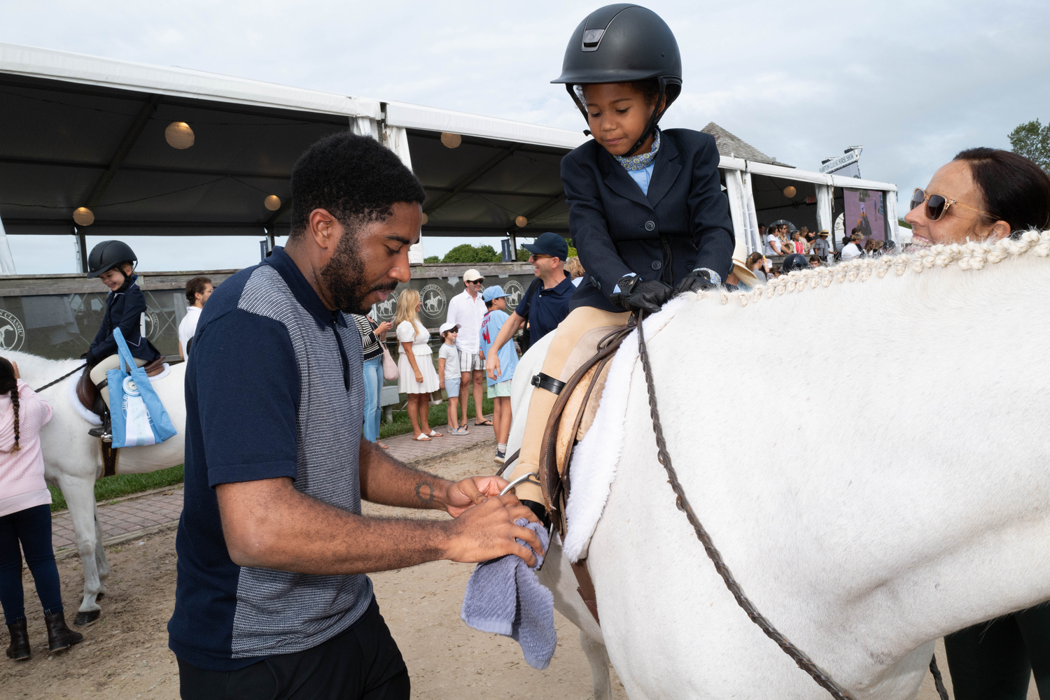 Nova Morsch prepares to head into the ring with the help of her uncle, Jari Willock.  LORI HAWKINS
