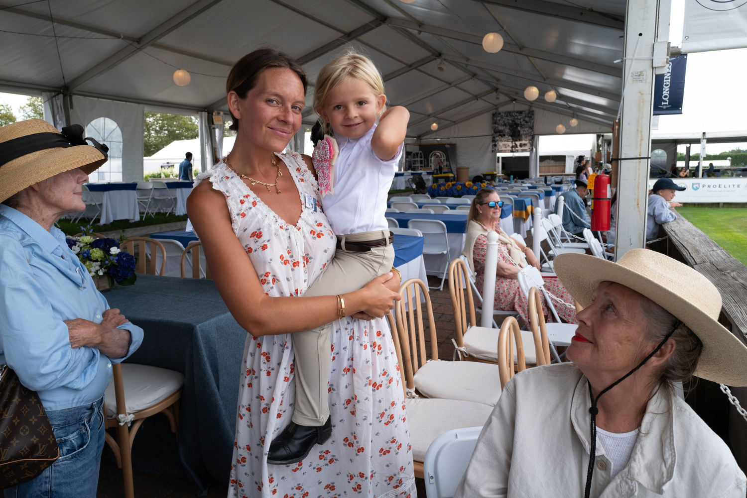 Nell Blagg with her daughter Scout Spooner, and  Allison O'Malley, left, and Anita Madeira at the Hampton Classic on Sunday.  LORI HAWKINS