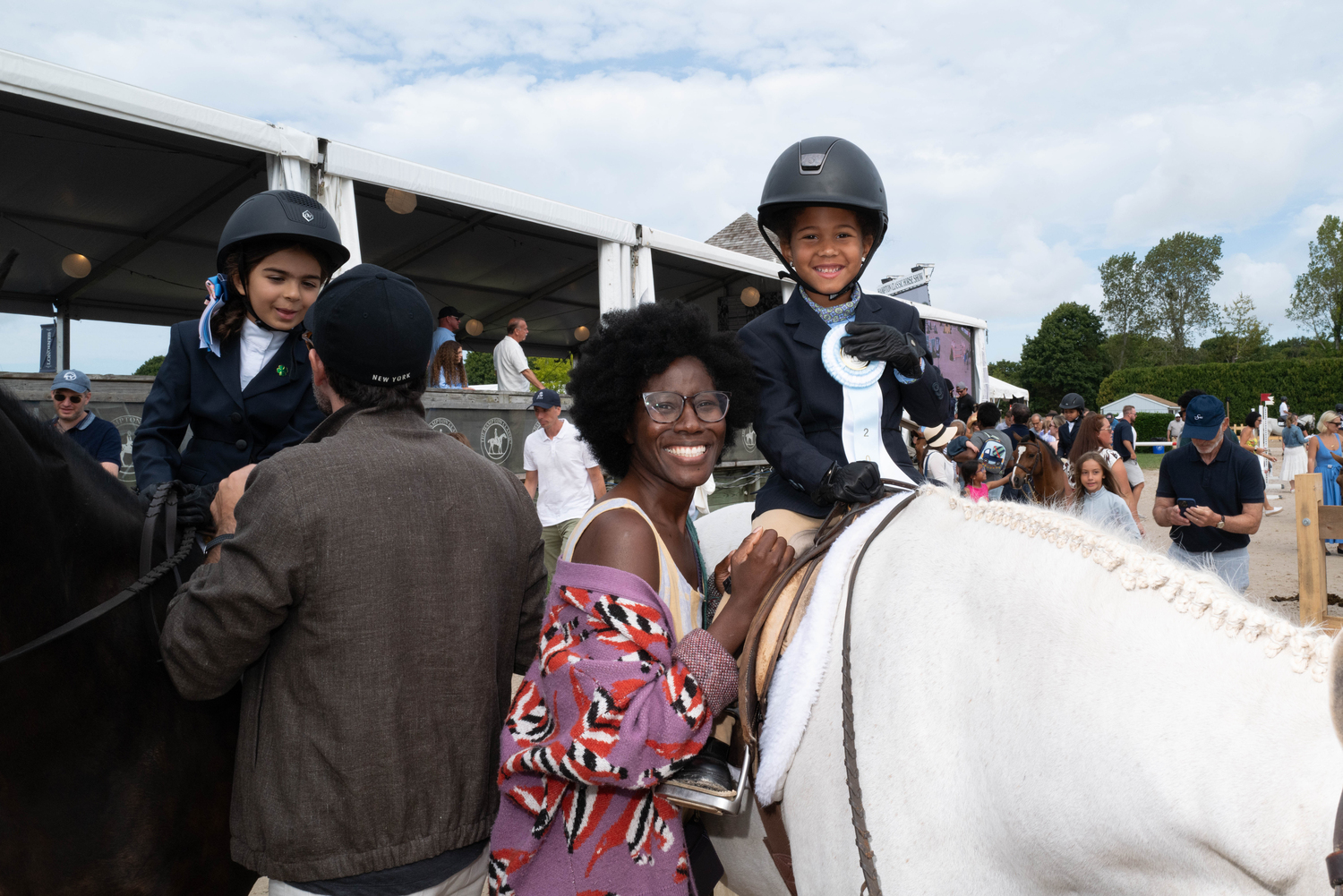 Nova Morsch with her mother Temidra Willock after Nova successfully completed her class on Locals Day at the Hampton Classic.  LORI HAWKINS