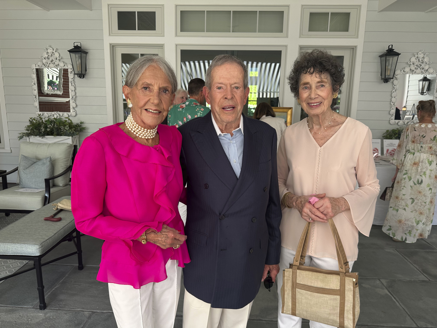 Lyn Hamer, Stuart Baker and Cornelia Bostwick at the Southampton Rose Society cocktail party.  GREGORY D'ELIA