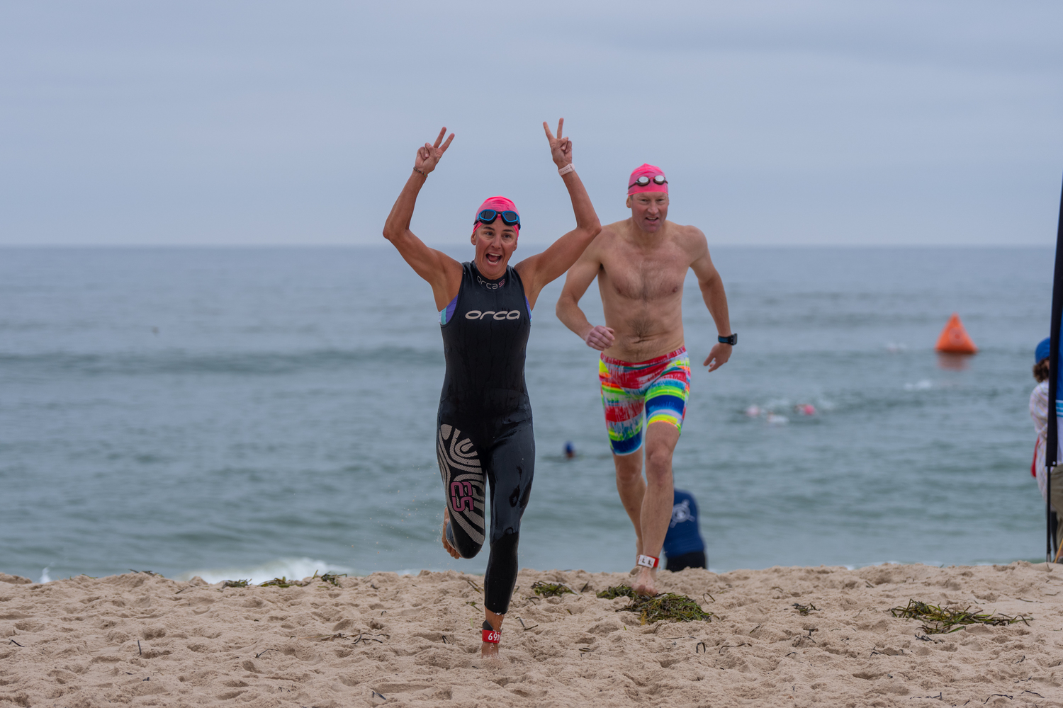 Brinlea Johnson heads out of the water after the 1-mile swim.   RON ESPOSITO