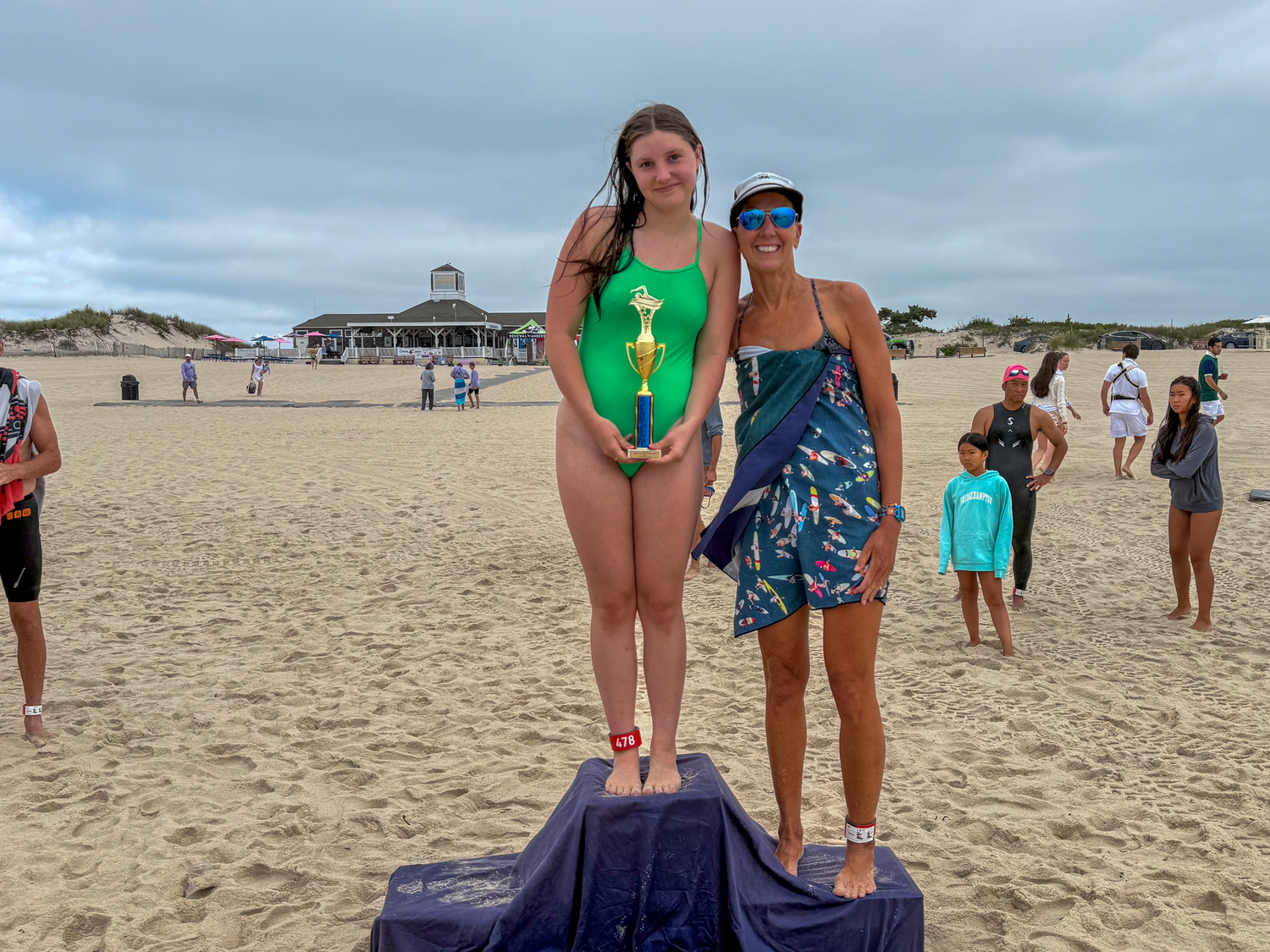 Female champion of the 1-mile swim Bridget Lockwood atop the podium with runner-up Angelika Cruz.  RON ESPOSITO