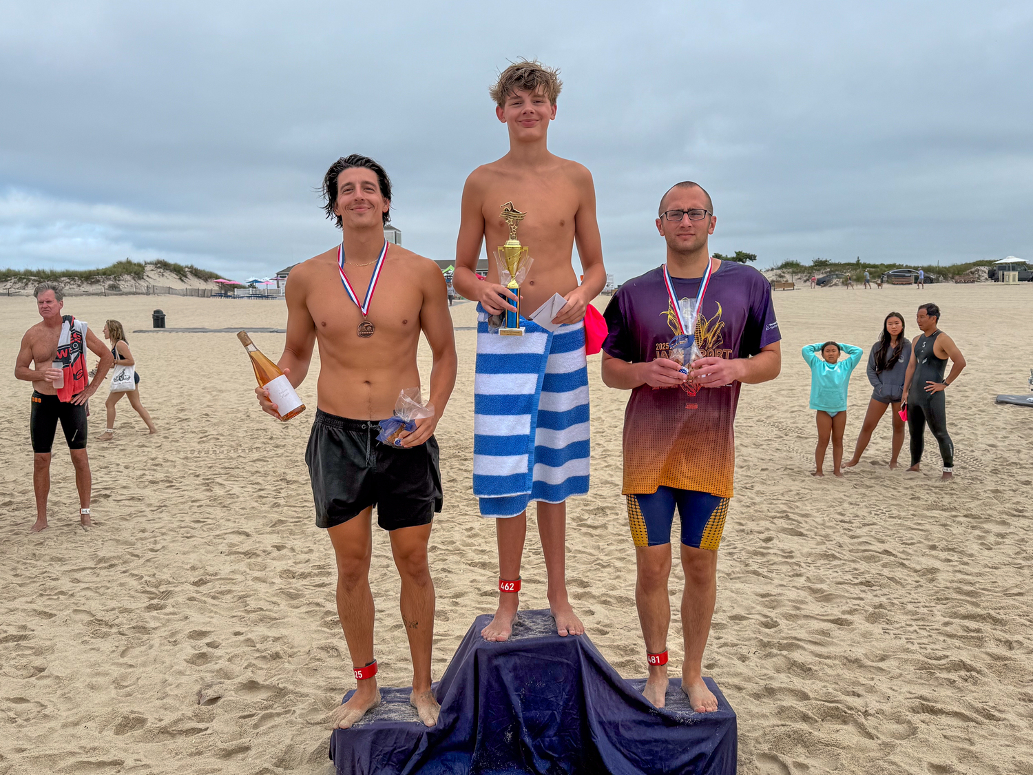 Luca Guerra atop the podium flanked by runner-up Daniel Mattei and Evan Brophy.   RON ESPOSITO