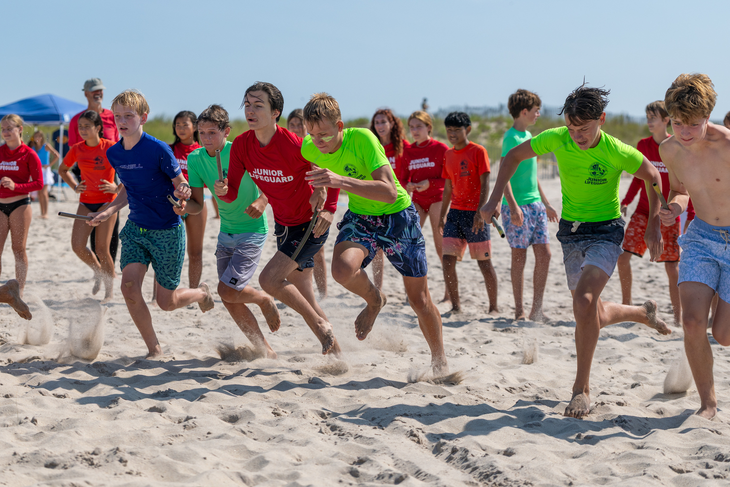 The boys head out in the 4x100 sand relay. RON ESPOSITO