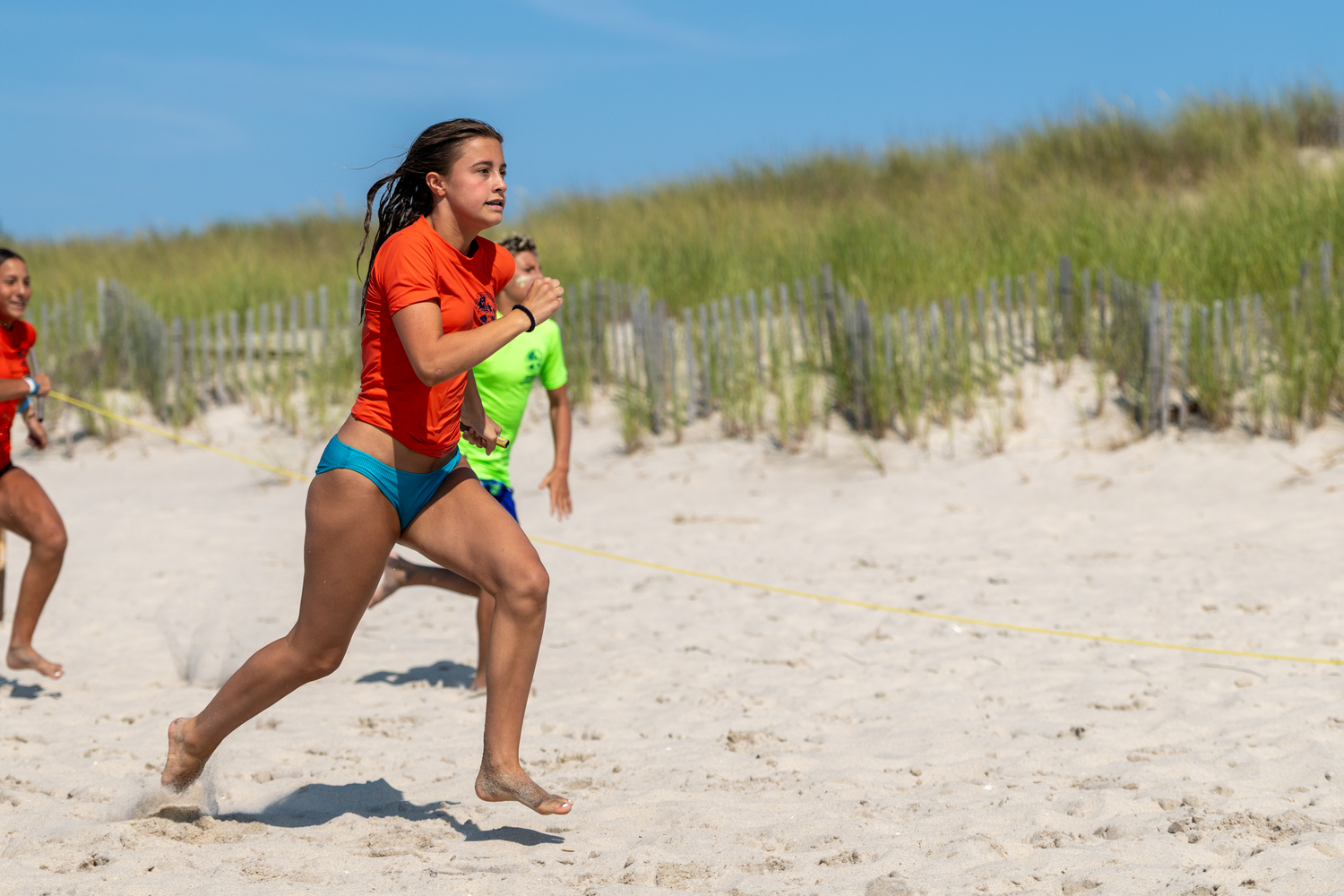 Kendall Riley competing in the 4x100 sand relay.  RON ESPOSITO