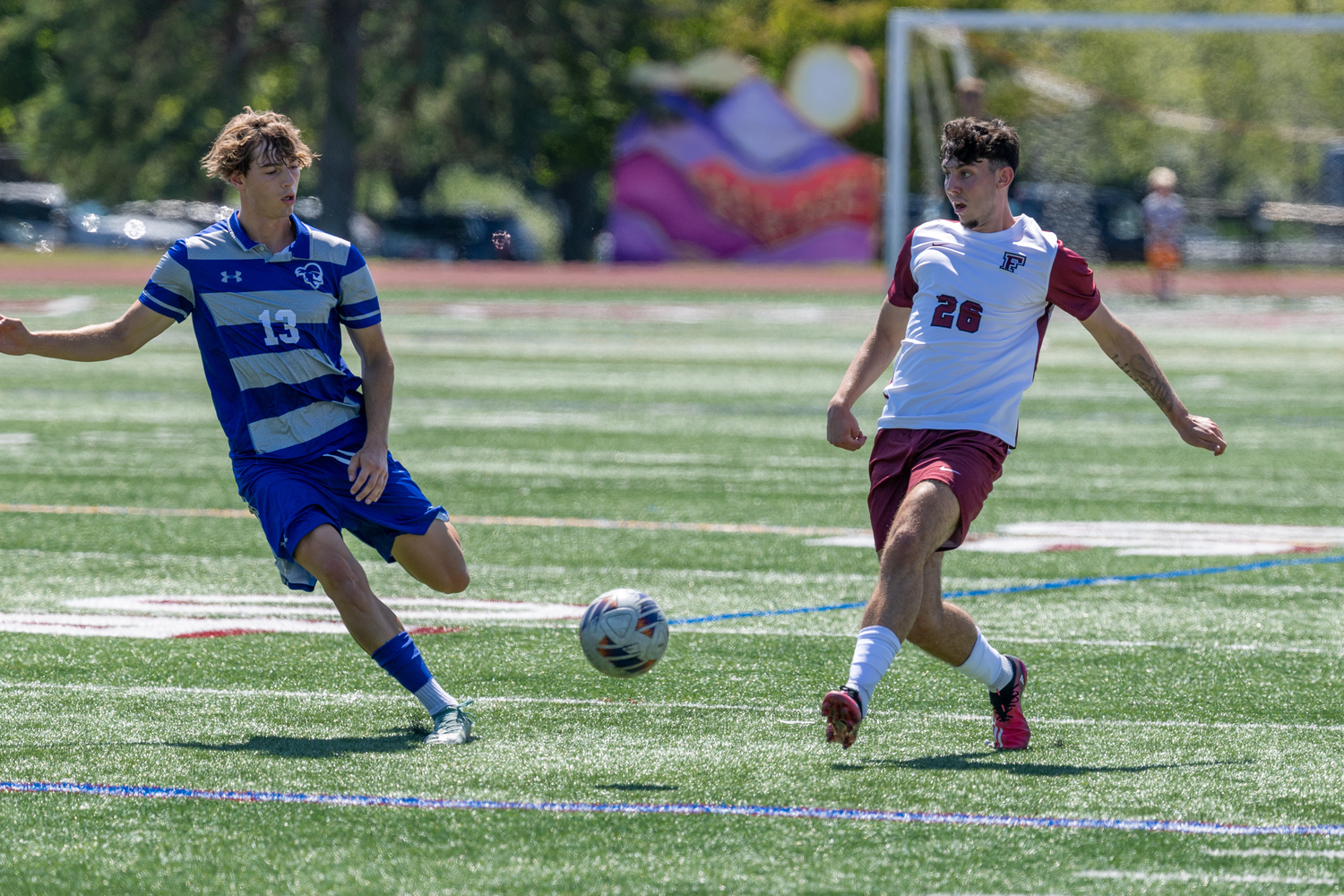 Fordham sophomore Daniel Lang passes with Seton Hall sophomore Til Kauschke pressuring.  RON ESPOSITO