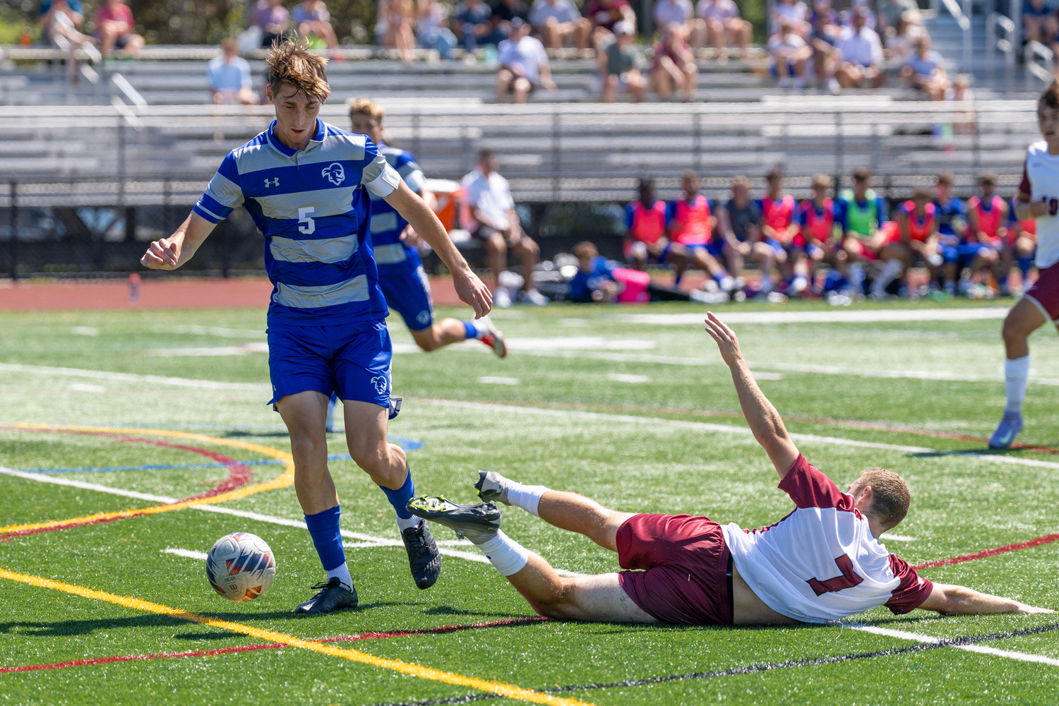 Fordham senior Andre Insalaco is on the turf in front of Seton Hall senior Agustin Resch.  RON ESPOSITO
