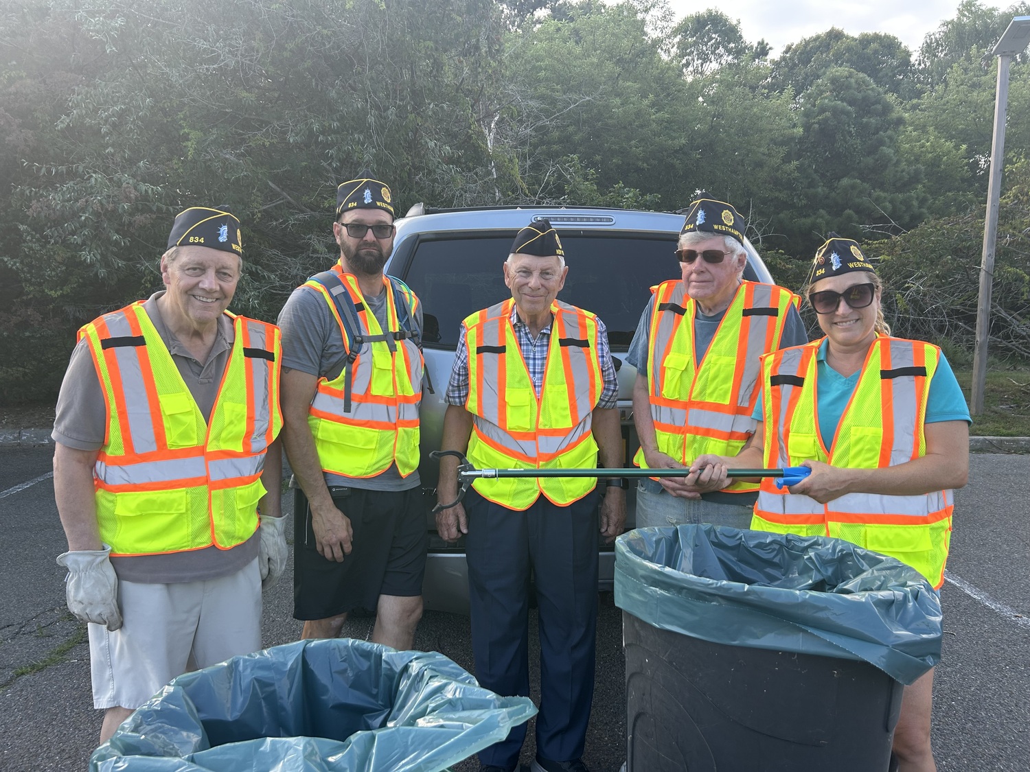 The hot weather didn't deter several members of American Legion Post 834 from picking up trash along Montauk Highway Westhampton recently. From left, Sandy Wyman, Matt Atkins, Tom Hadlock, George Motz, and Lisha Terry. COURTESY TOM HADLOCK