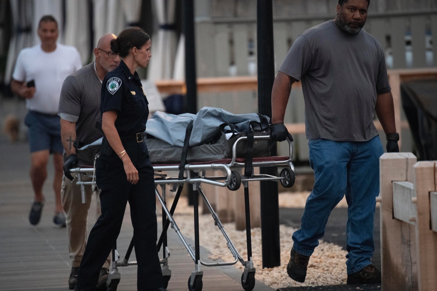 The Suffolk County Medical Examiner's office removed evidence from a boat at the Montauk Yacht Club on Tuesday evening, nearly 18 hours after a woman was found dead.