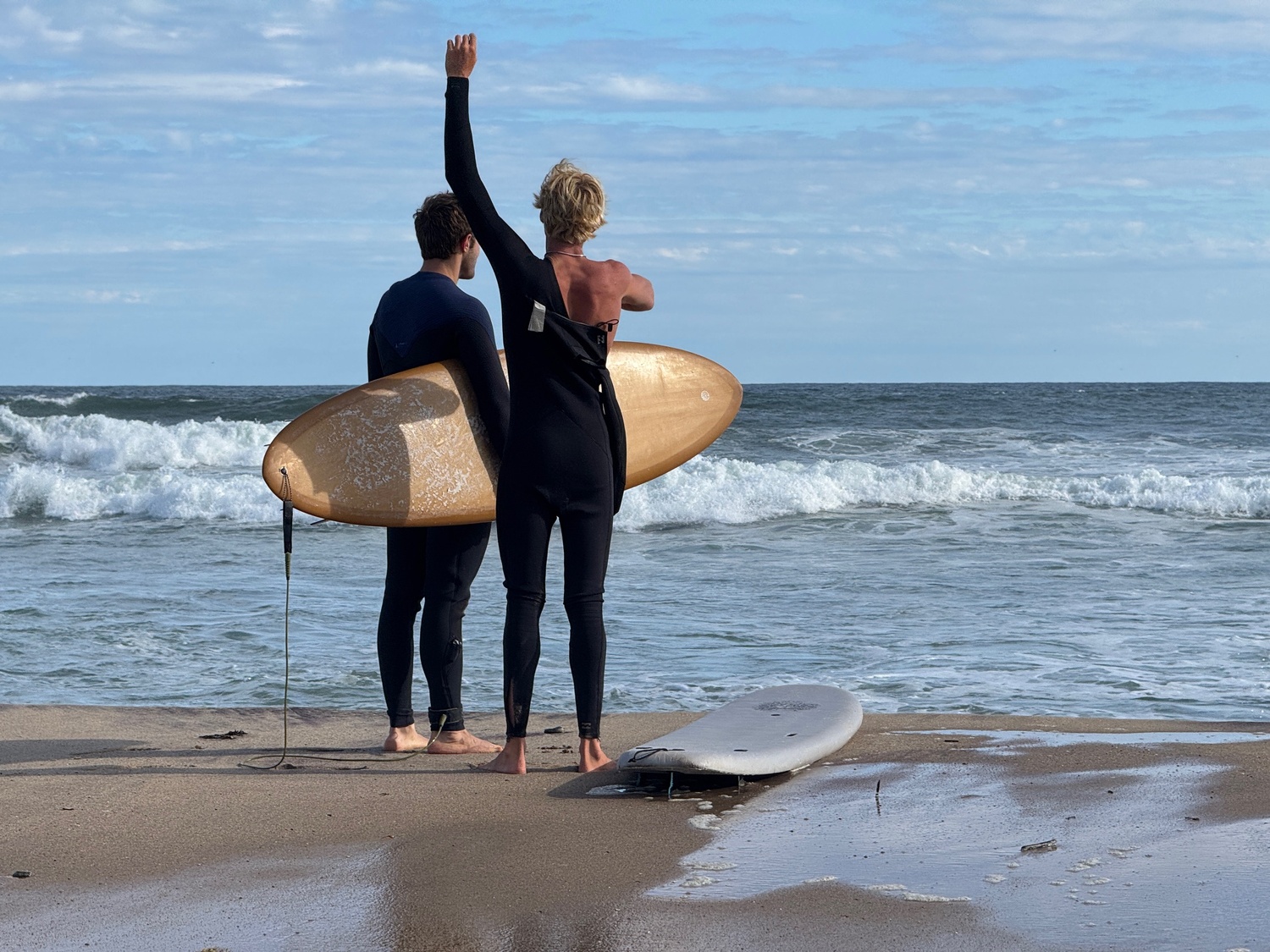 Surfers eagerly anticipating swells up to 15 feet from Hurricane Erin arriving on the South Fork beaches on Wednesday. EMMA WRIGHT