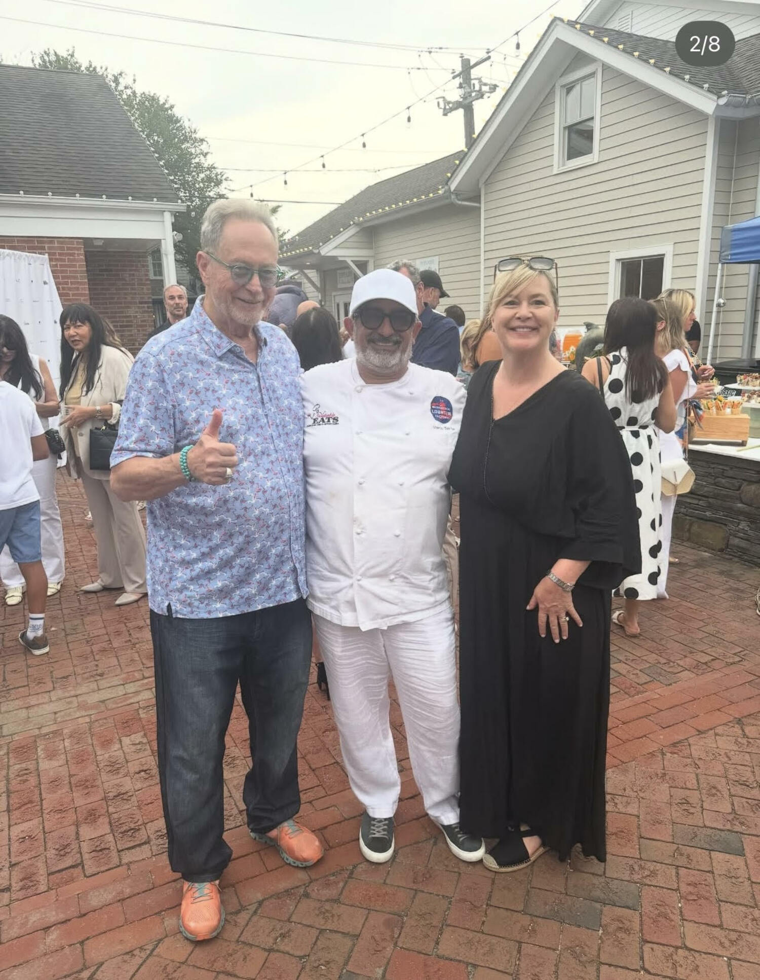Marco Barrilla, artist John Melillo and Sheila Barrilla at a benefit for Citizens for Humanity, earlier this month in Southampton Village.