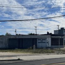 The owner of the defunct gas station on the Riverside traffic circle has proposed reviving the gas station on the property along with a 7-Eleven convenience store on an adjoining property along Flanders Road. BILL SUTTON