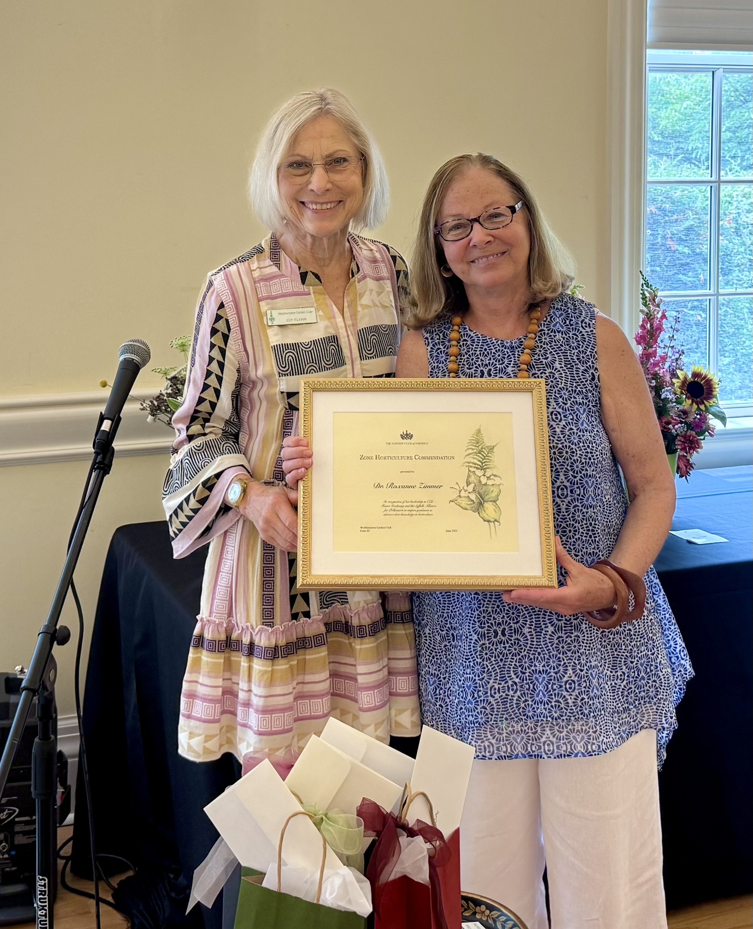 At the Westhampton Garden Club's annual meeting, Roxanne Zimmer Ph.D., right, was awarded the Garden Club of America's  Horticulture Commendation for her impact on the education and training of home gardeners and the founding the Suffolk Alliance of Pollinators.  Joy Flynn, the club's president, right, made the presentation. As the Cornell Cooperative Extension Community Horticultural Specialist, Zimmer has trained hundreds of master gardeners who in turn have been inspired to teach others. Three years ago, she founded the Suffolk Alliance for Pollinators, now a network of organizations and people across Suffolk County creating a pollinator pathway with the support of the legislature, and educating others through workshops, free tours of native plant gardens, and seed swaps. As a clinical Instructor at Stony Brook University, she and her team  have given hundreds of talks spreading the word about the vital importance of native plants, support for pollinators and the use of ecological practices. COURTESY WESTHAMPTON GARDEN CLUB