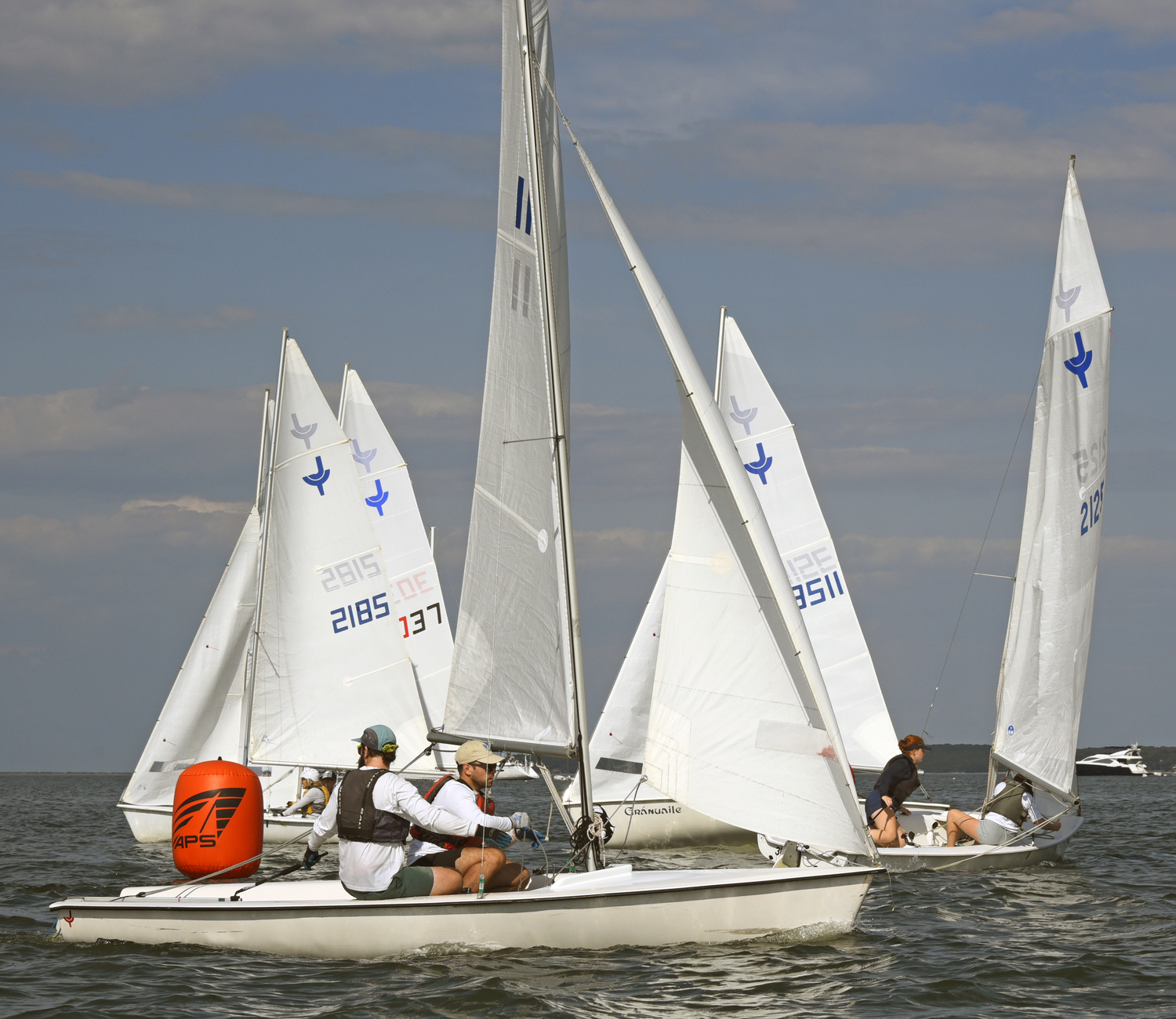 Venetia Satow and Ava Kenny, far right, first to round the leeward mark on their way to the finish line.  MICHAEL MELLA