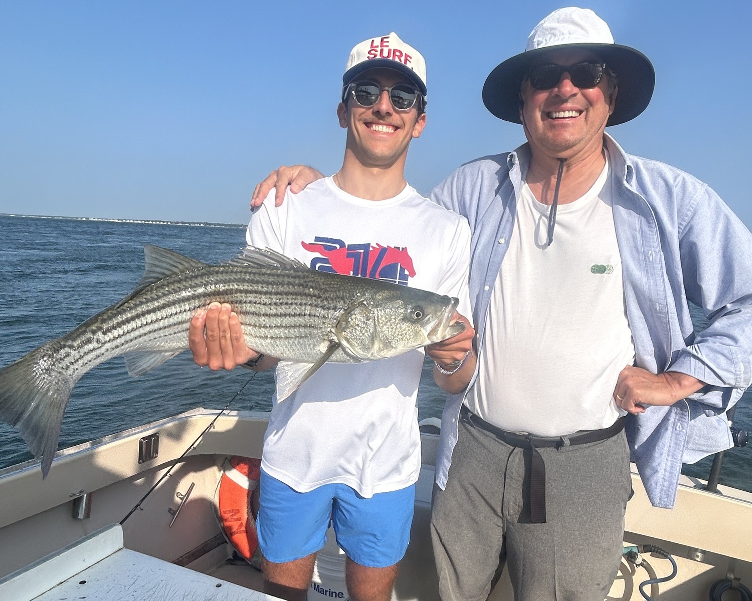 Bobby and Tom Walker caught this slot striped bass fishing with Someday Came Charters in Shinnecock Bay last month. CAPT. BRAD RIES