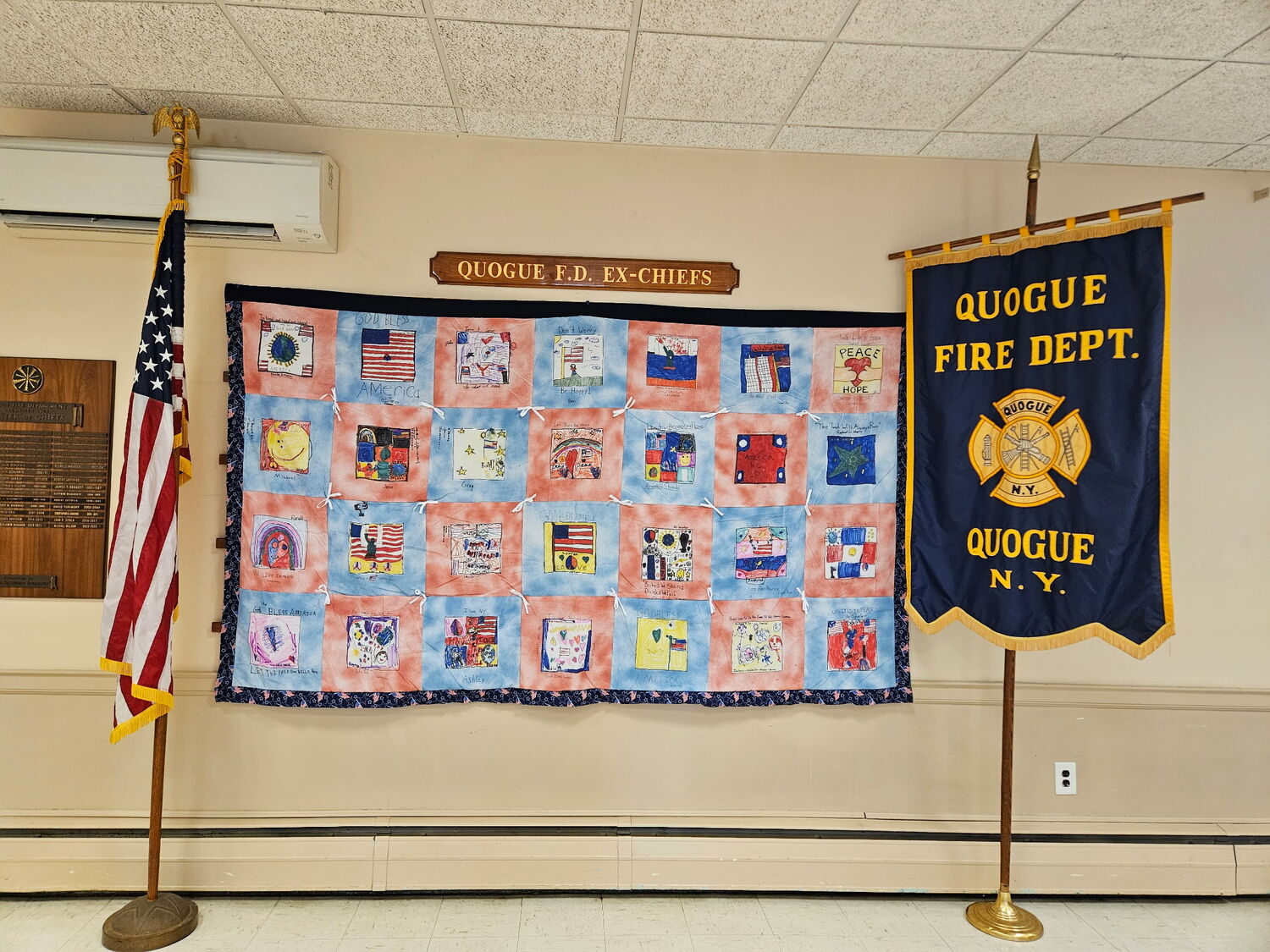 Quilts with squares handmade by Quogue School students in the aftermath of the September 11 attacks in 2001 are currently on display at the Quogue Firehouse. COURTESY QUOGUE VILLAGE FD