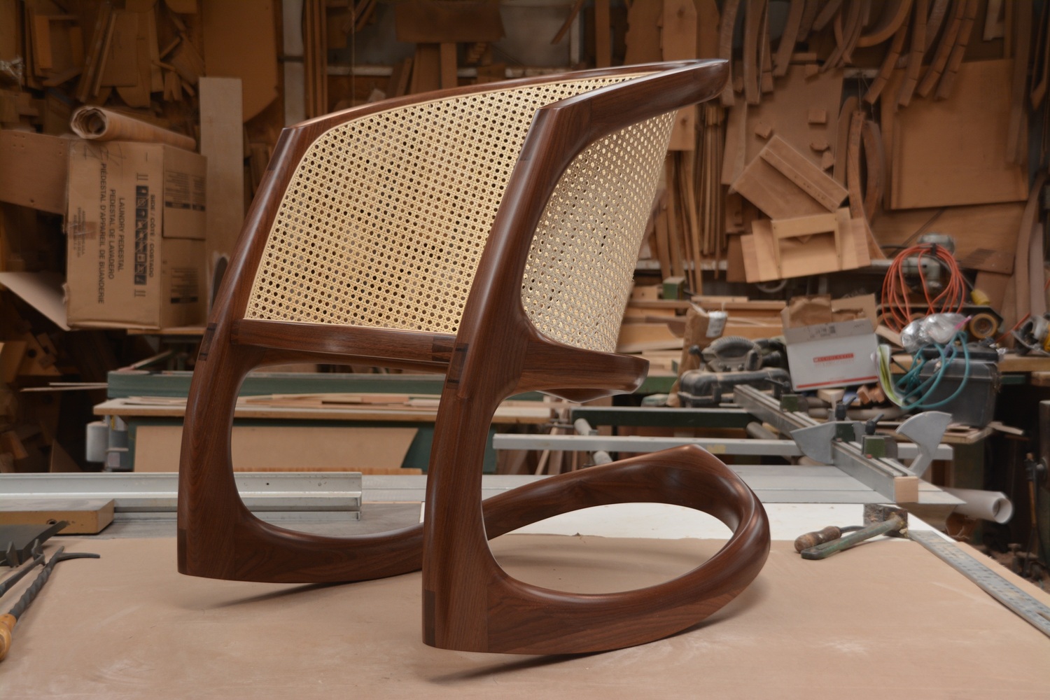 A Sternum bone rocking chair, crafted of walnut and cane by furniture maker David Ebner. COURTESY THE BRIDGEHAMPTON MUSEUM