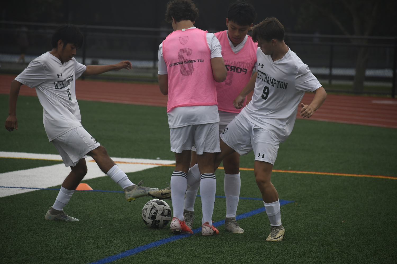 The Hurricanes practice just before their scrimmage with Half Hollow Hills West on Monday morning.  DREW BUDD