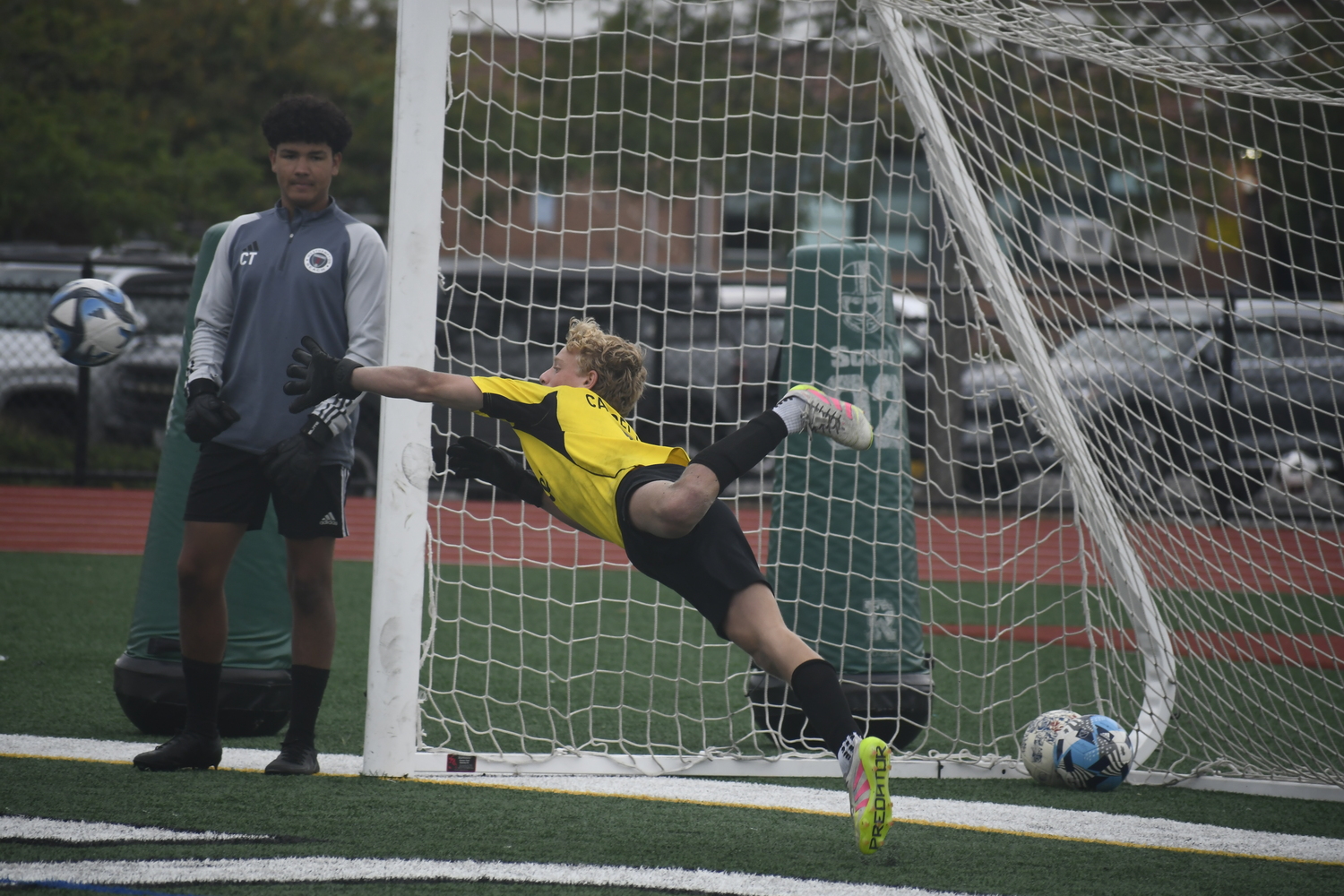 Nate Cangelosi dives to make a save in warmups Monday morning.  DREW BUDD
