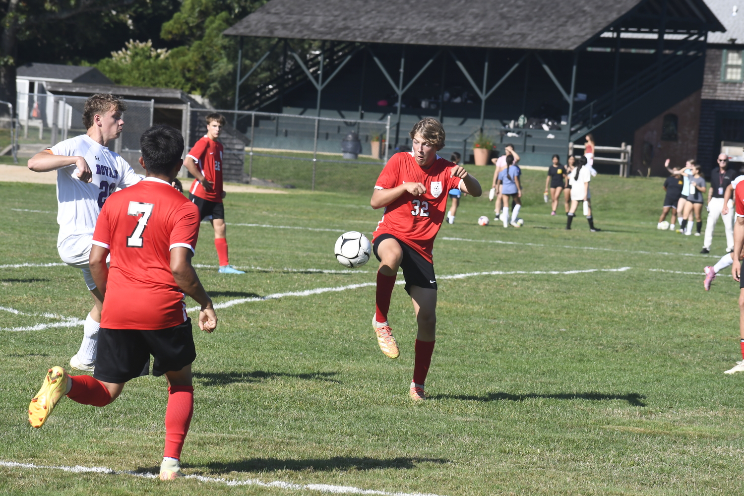 Pierson junior Locklin Beard clears an incoming ball into the box.  DREW BUDD
