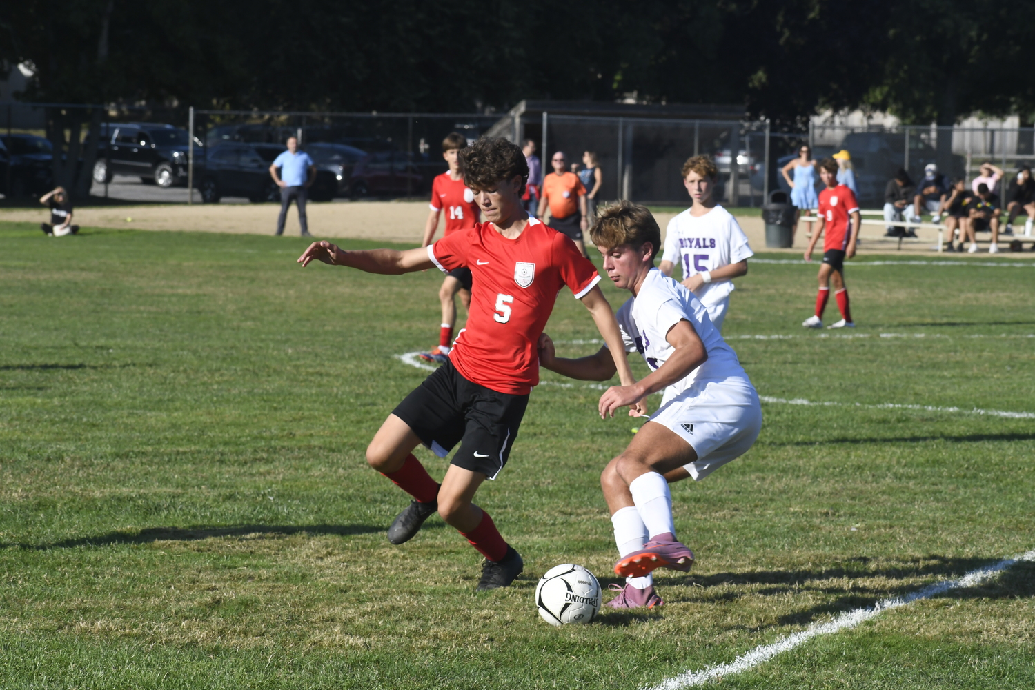 Pierson junior Vlad Korchynskyi tries to stop Port Jeff's Marco Baranta.   DREW BUDD