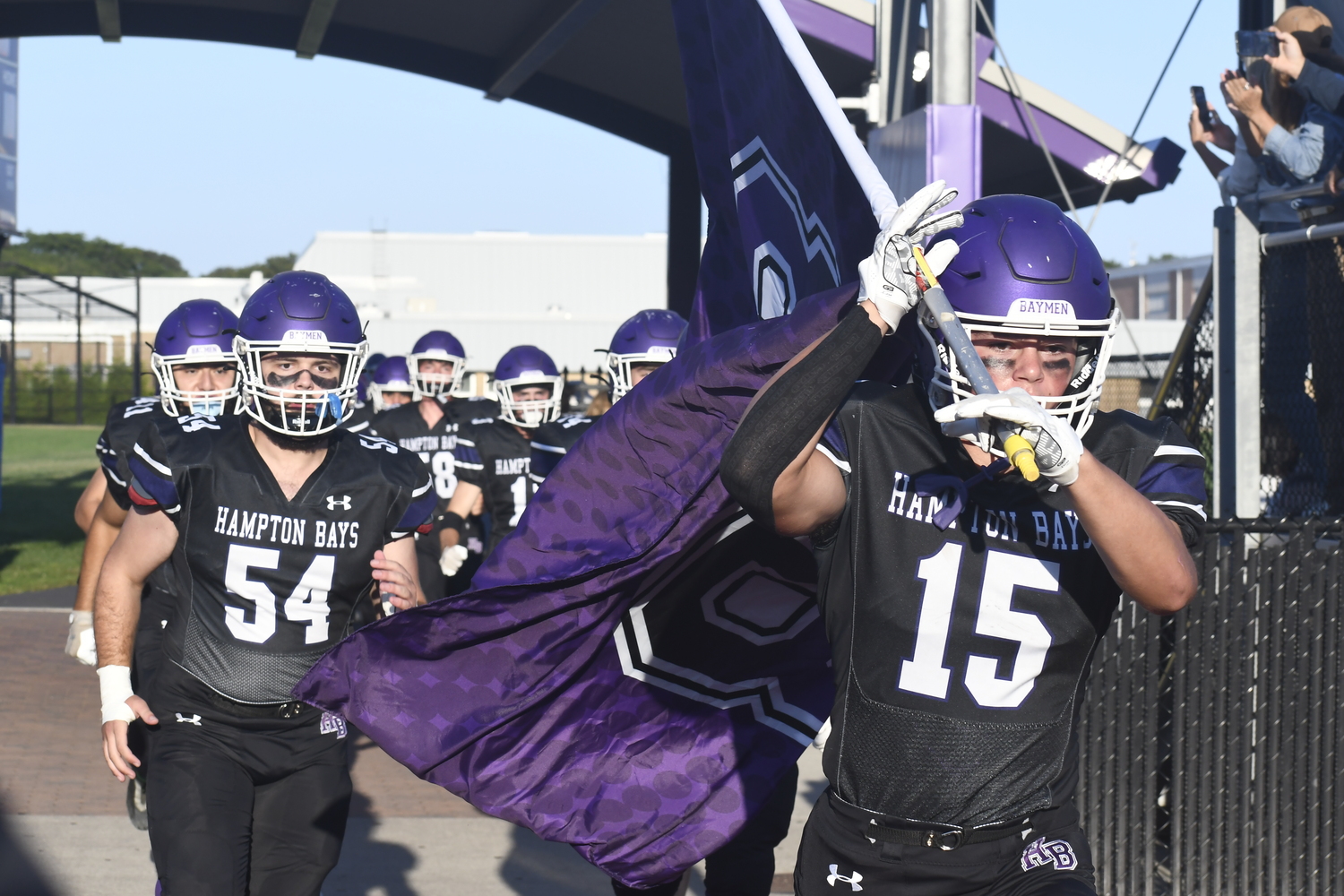 Brayden Talmage leads the Baymen onto their home turf on Friday evening.  DREW BUDD