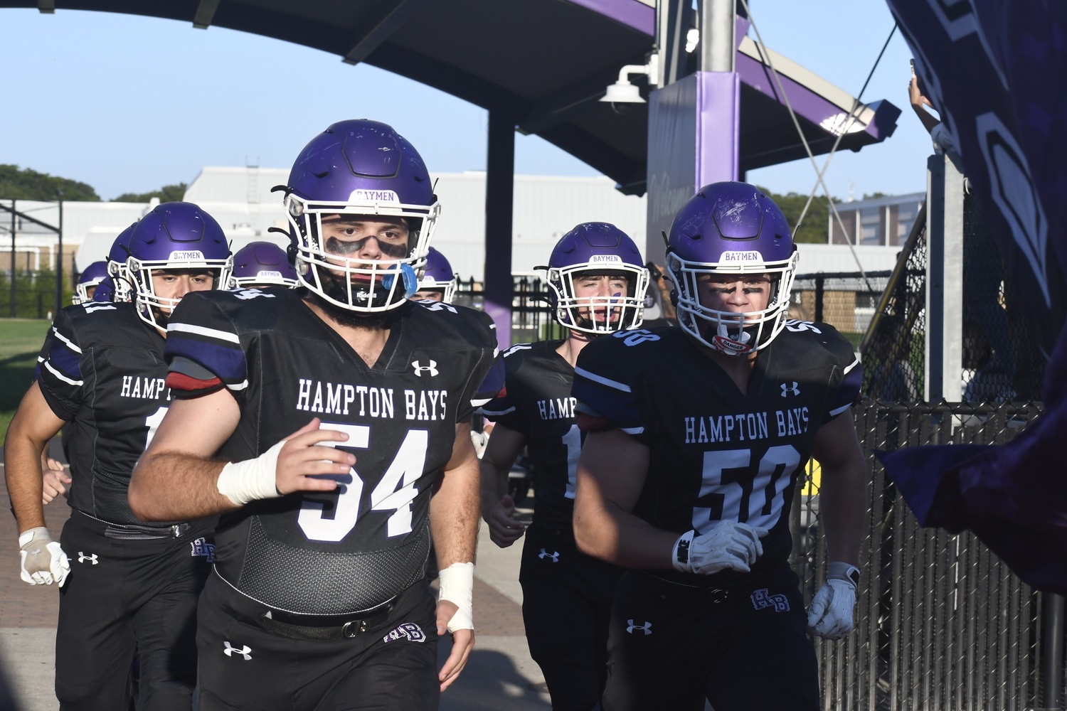 Gabe Defrancesco and  help lead the Baymen onto the field on Friday evening. DREW BUDD