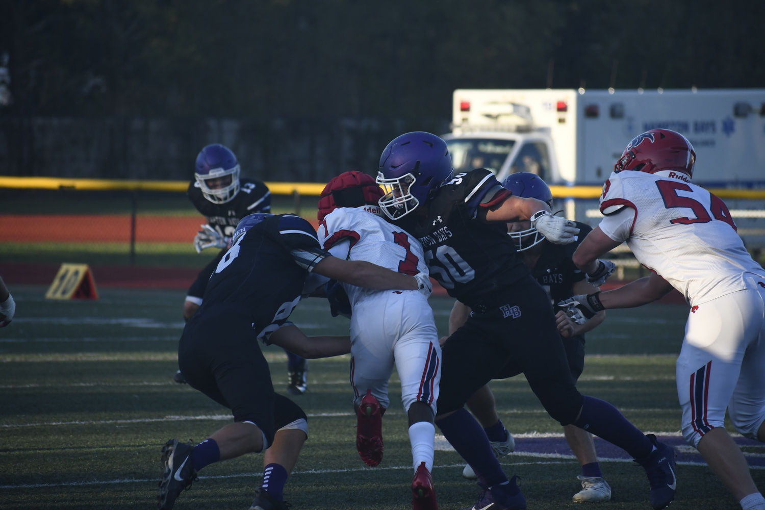 68 AND 58 team up on a tackle.  DREW BUDD