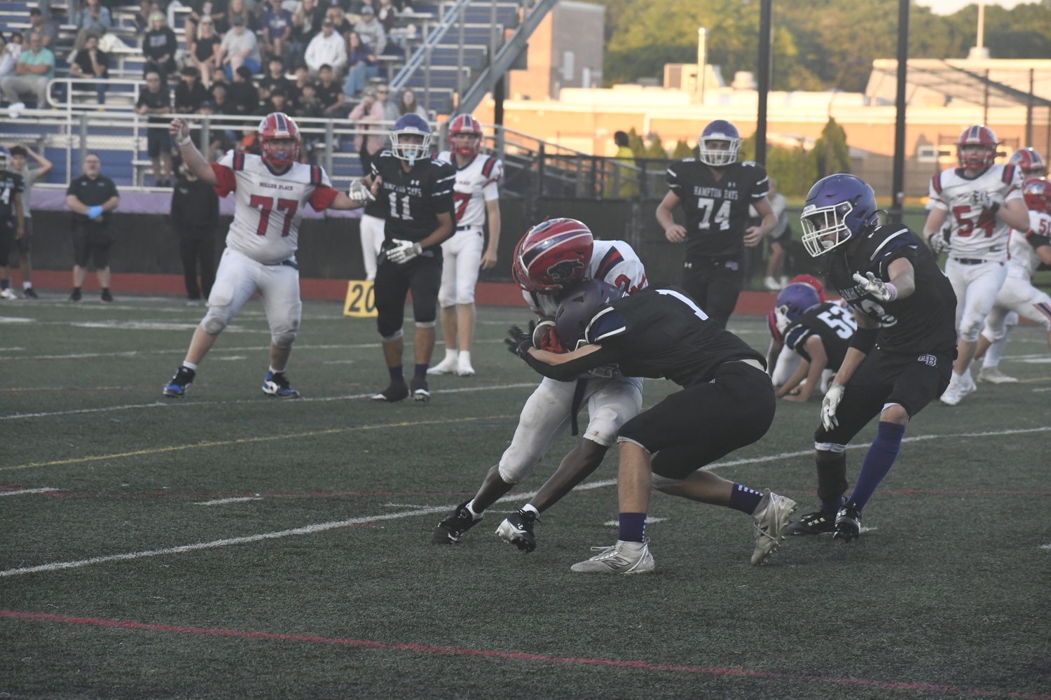 Hampton Bays junior Owen Haynes lands the initiall hit on Miller Place.  DREW BUDD