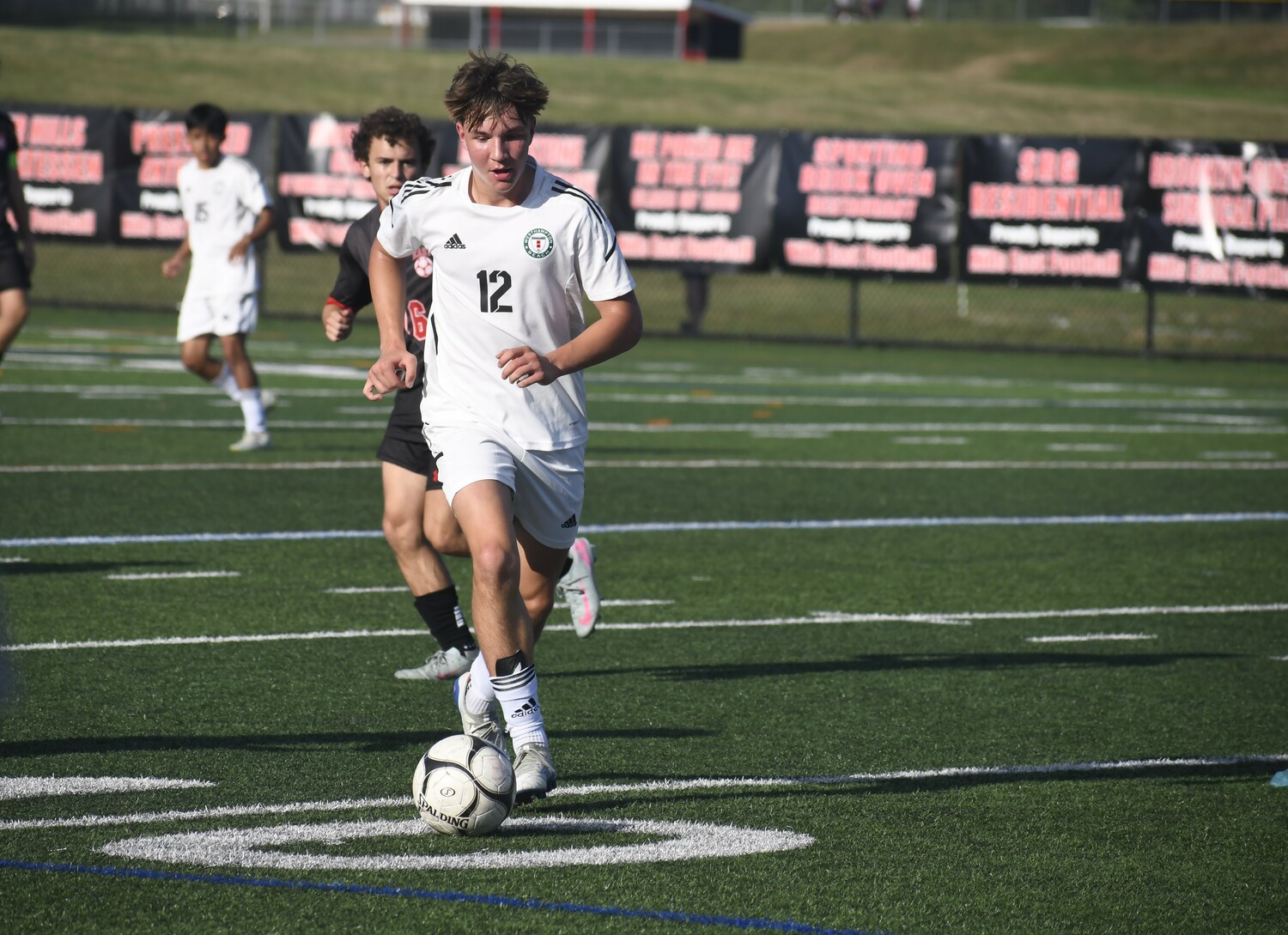 Westhampton Beach sophomore Adam Gibas brings the ball up the field.  DREW BUDD