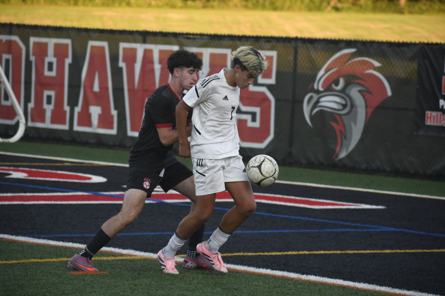 Westhampton Beach sophomore Nicholas Paga plays a throw-in off his body.  DREW BUDD
